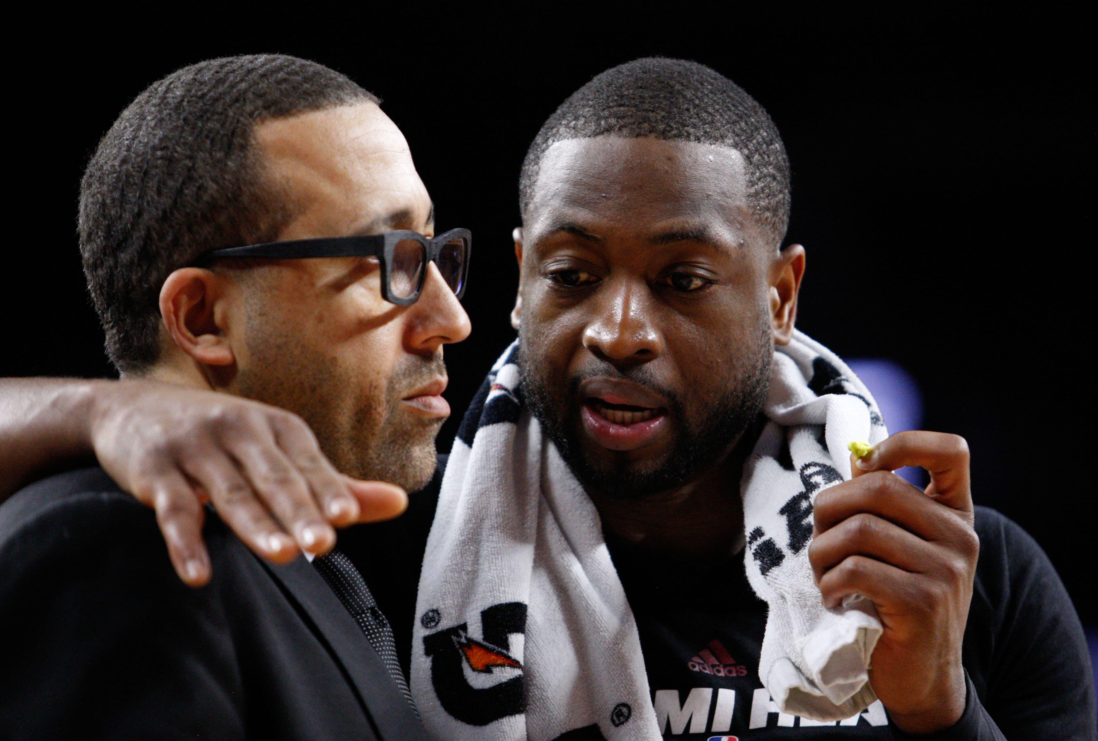 Apr 12, 2016; Auburn Hills, MI, USA; Miami Heat guard Dwyane Wade (3) talks to assistant head coach David Fizdale during the third quarter against the Detroit Pistons at The Palace of Auburn Hills. Heat win 99-93. Mandatory Credit: Raj Mehta-USA TODAY Sports / Raj Mehta