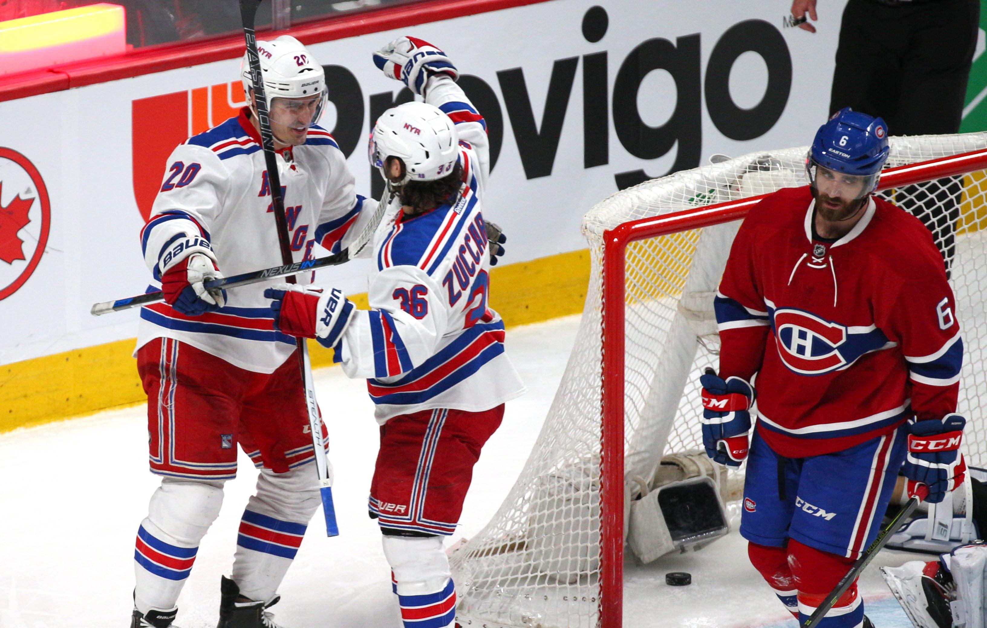 Mar 26, 2016; Montreal, Quebec, CAN; New York Rangers left wing Chris Kreider (20) celebrates his goal against Montreal Canadiens with teammate right wing Mats Zuccarello (36) and defenseman Greg Pateryn (6) during the second period at Bell Centre. Mandatory Credit: Jean-Yves Ahern-USA TODAY Sports / Jean-Yves Ahern