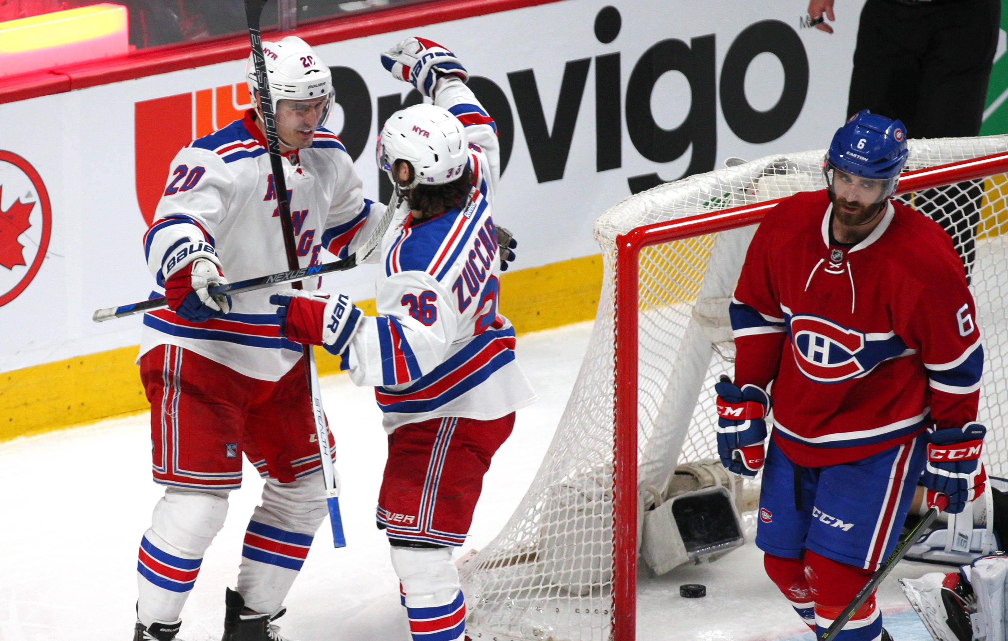 Mar 26, 2016; Montreal, Quebec, CAN; New York Rangers left wing Chris Kreider (20) celebrates his goal against Montreal Canadiens with teammate right wing Mats Zuccarello (36) and defenseman Greg Pateryn (6) during the second period at Bell Centre. Mandatory Credit: Jean-Yves Ahern-USA TODAY Sports