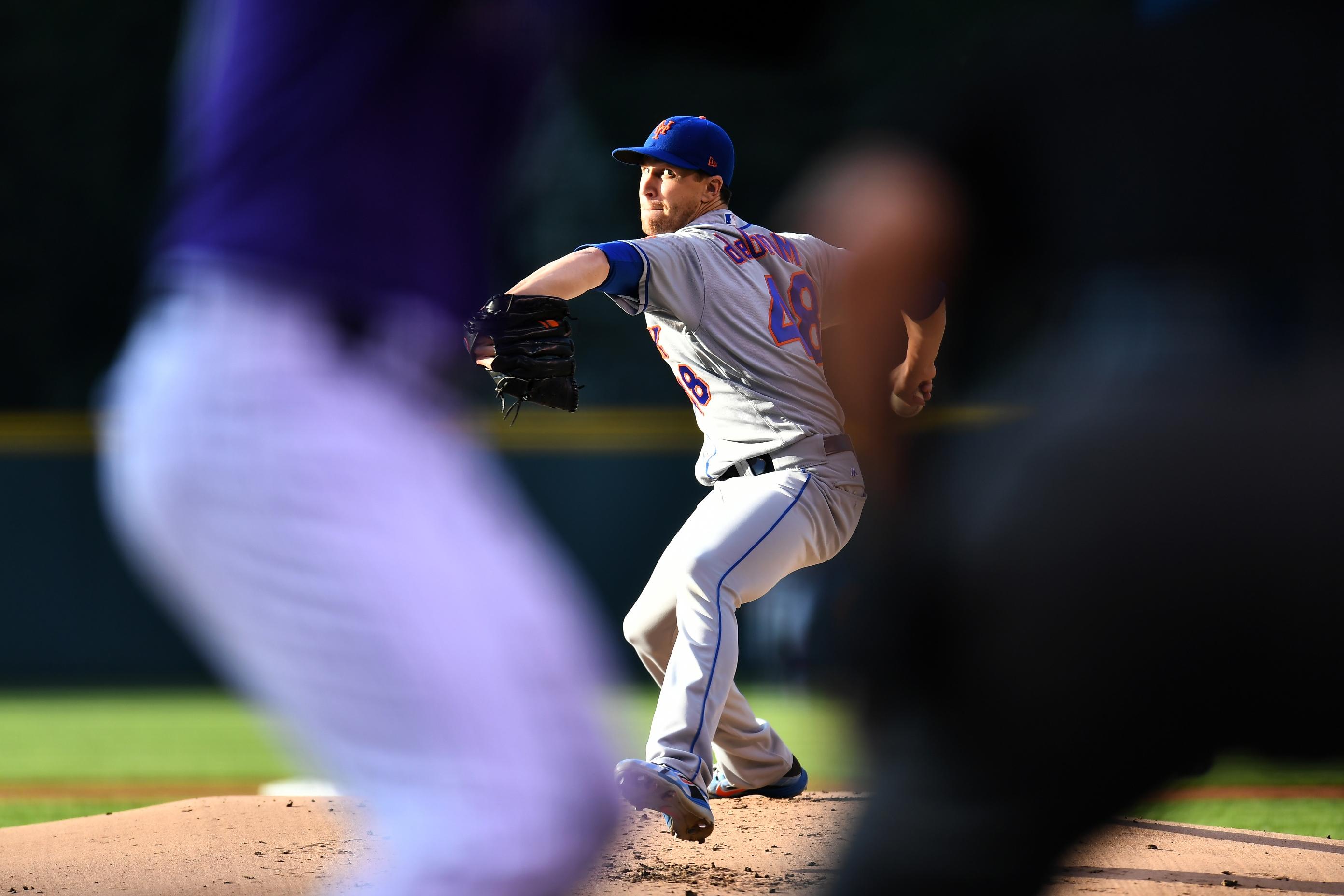 New York Mets starting pitcher Jacob deGrom delivers a pitch in the first inning against the Colorado Rockies at Coors Field.