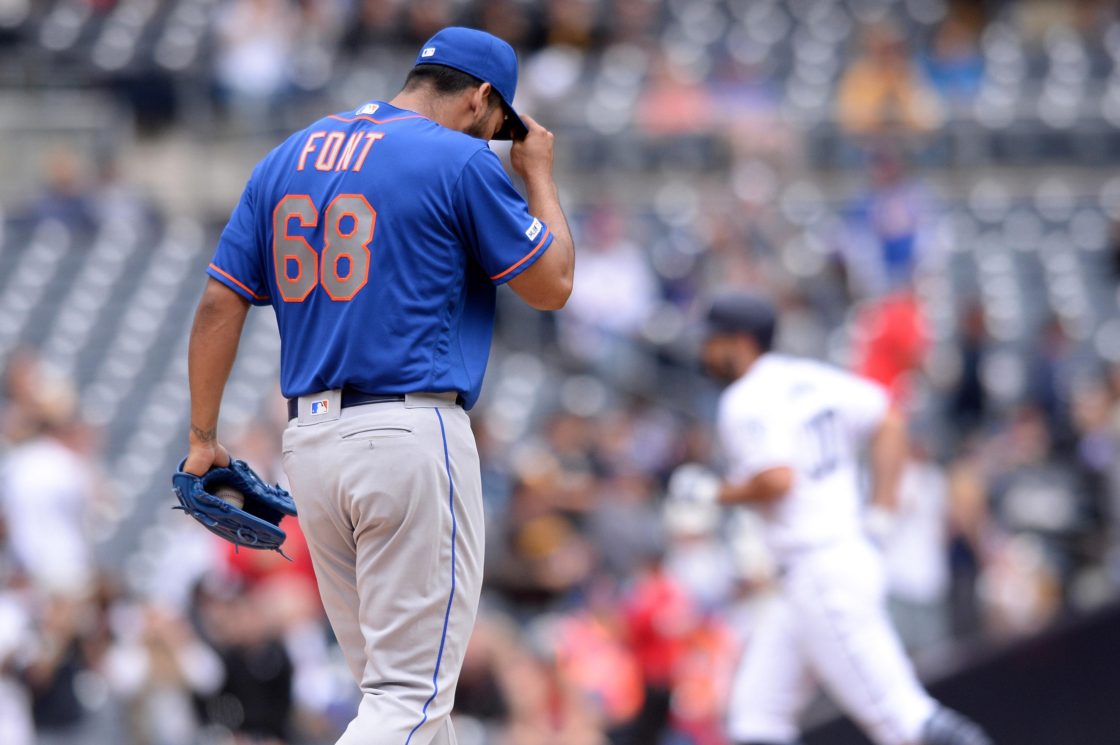 May 8, 2019; San Diego, CA, USA; New York Mets starting pitcher Wilmer Font (68) reacts on the mound after giving up a home run to San Diego Padres first baseman Eric Hosmer (right) during the second inning at Petco Park. Mandatory Credit: Orlando Ramirez-USA TODAY Sports