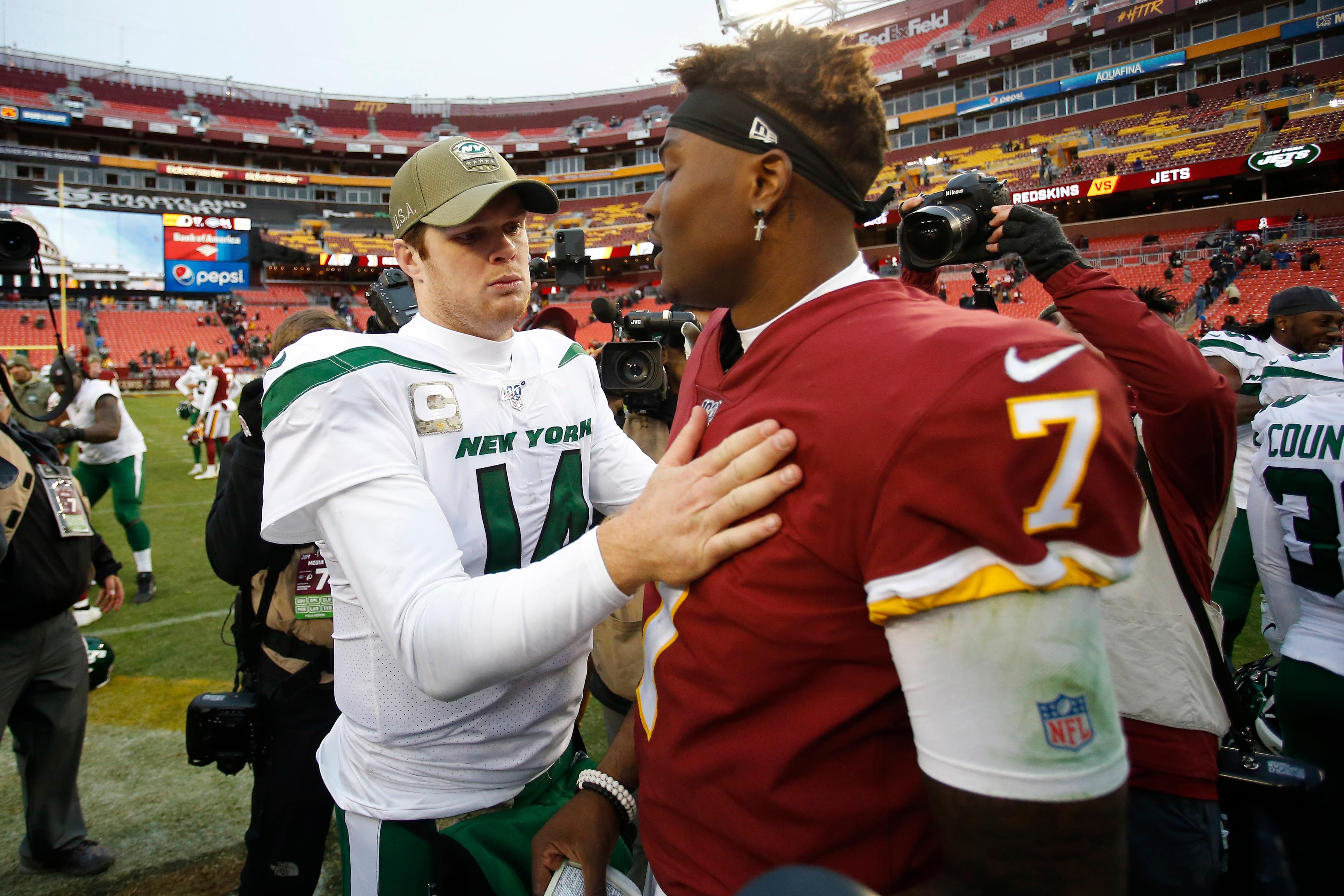 Nov 17, 2019; Landover, MD, USA; New York Jets quarterback Sam Darnold (14) talks with Washington Redskins quarterback Dwayne Haskins (7) after their game at FedExField. Mandatory Credit: Geoff Burke-USA TODAY Sports