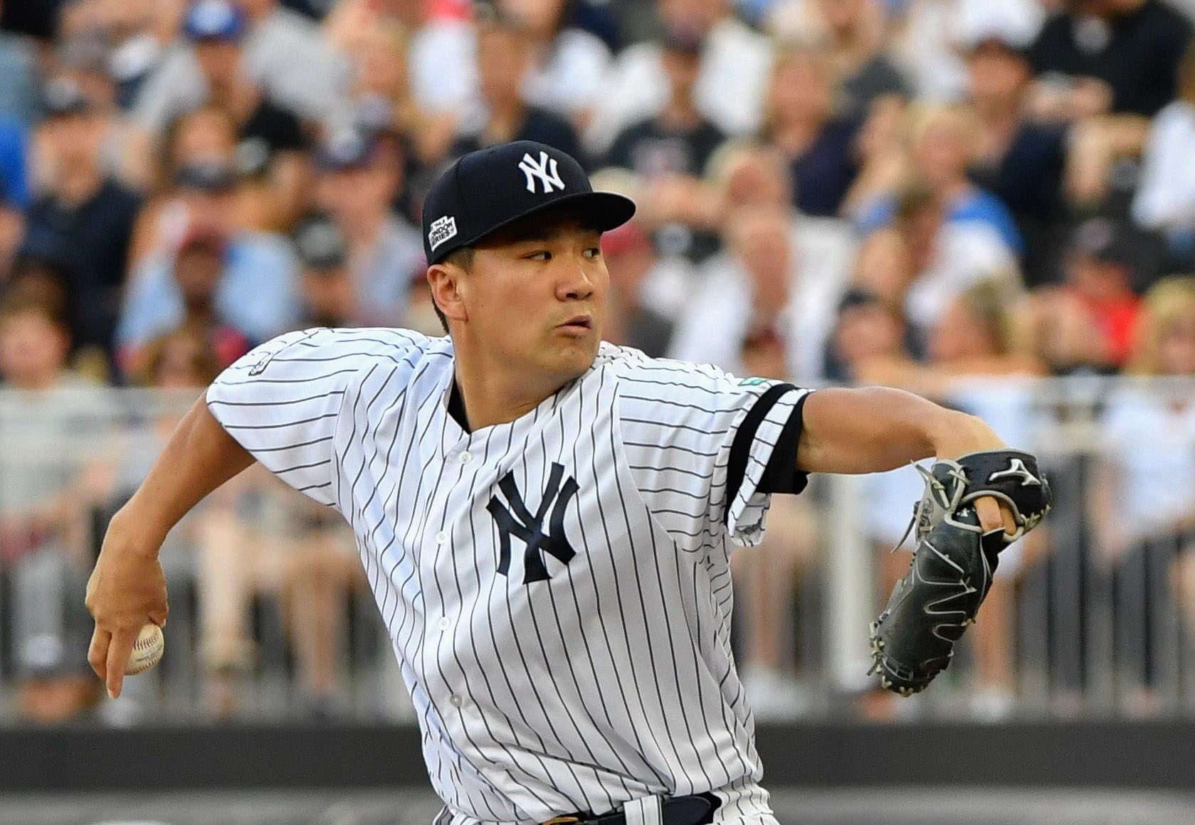 New York Yankees starting pitcher Masahiro Tanaka throws a pitch during the first inning against the Boston Red Sox at London Stadium. / Steven Flynn/USA TODAY Sports