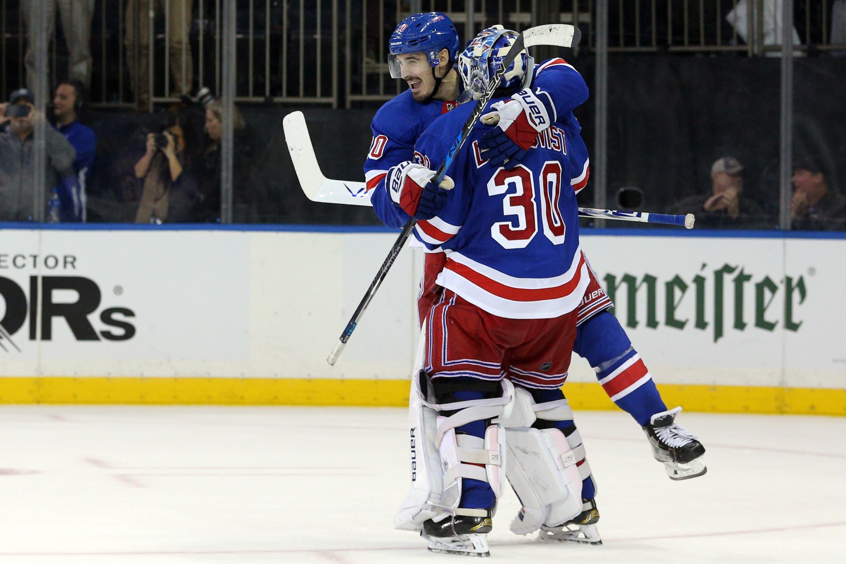 Oct 16, 2018; New York, NY, USA; New York Rangers goalie Henrik Lundqvist (30) is congratulated by New York Rangers left wing Chris Kreider (20) after making the game winning save against the Colorado Avalanche during the shootout at Madison Square Garden. Mandatory Credit: Brad Penner-USA TODAY Sports / Brad Penner