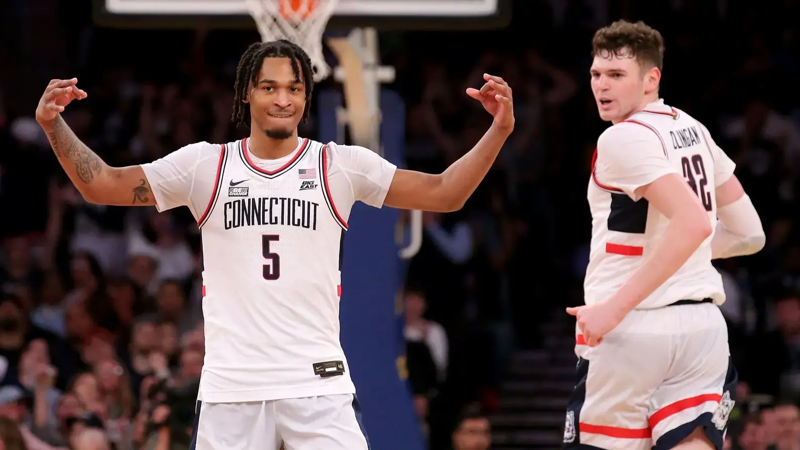 Mar 16, 2024; New York City, NY, USA; Connecticut Huskies guard Stephon Castle (5) and center Donovan Clingan (32) react during the second half against the Marquette Golden Eagles at Madison Square Garden.