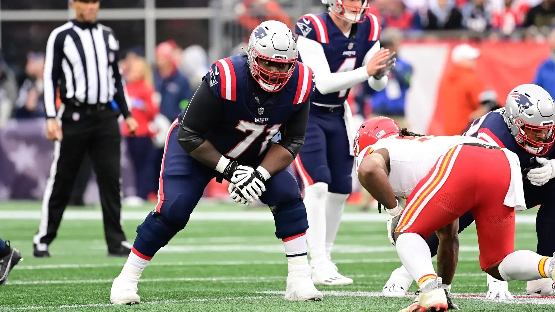 Dec 17, 2023; Foxborough, Massachusetts, USA; New England Patriots guard Mike Onwenu (71) lines up against the Kansas City Chiefs during the second half at Gillette Stadium. / Eric Canha-USA TODAY Sports
