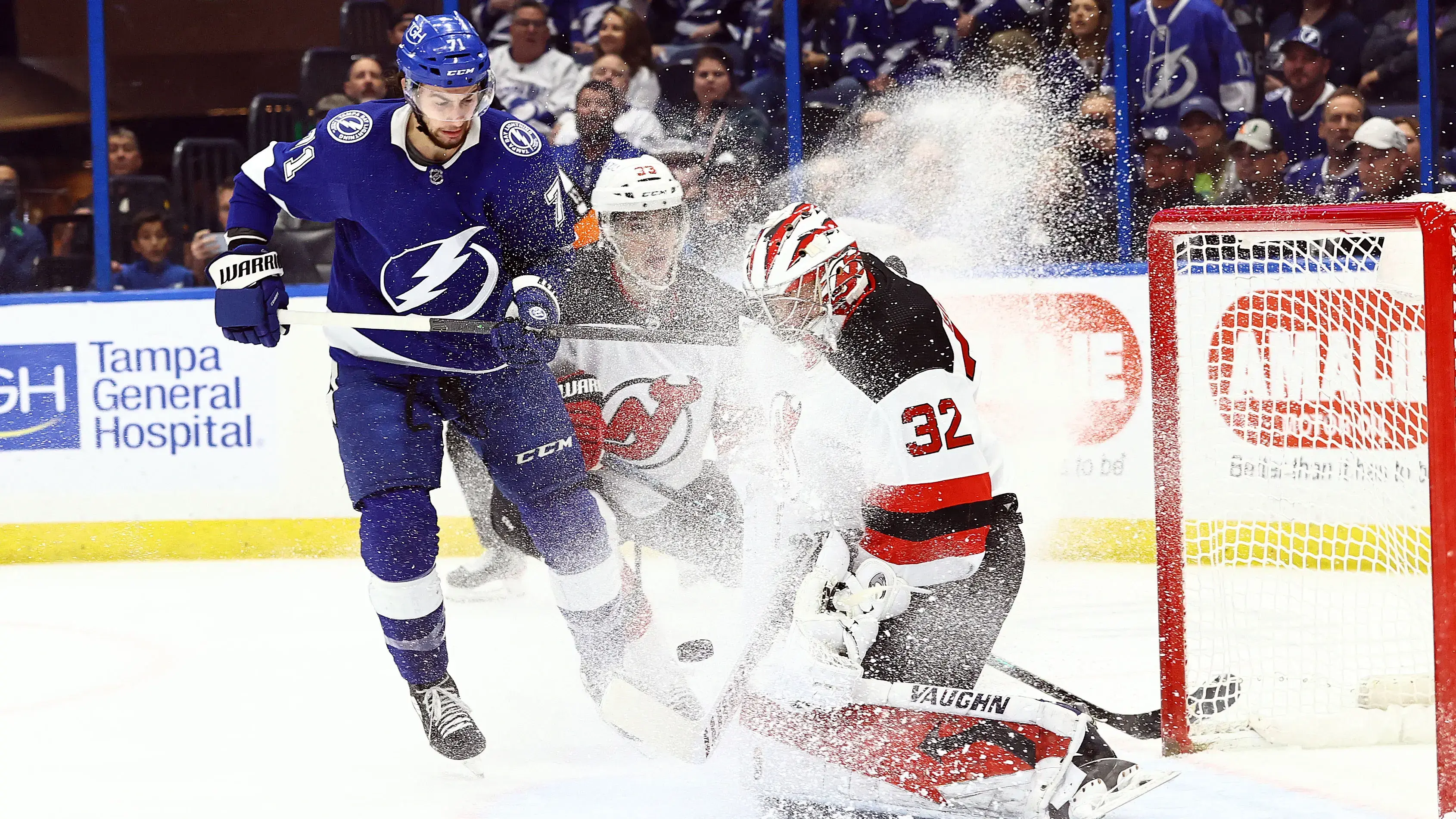 Jan 27, 2022; Tampa, Florida, USA; New Jersey Devils goaltender Jon Gillies (32) makes a save against the Tampa Bay Lightning during the first period at Amalie Arena. / Kim Klement-USA TODAY Sports