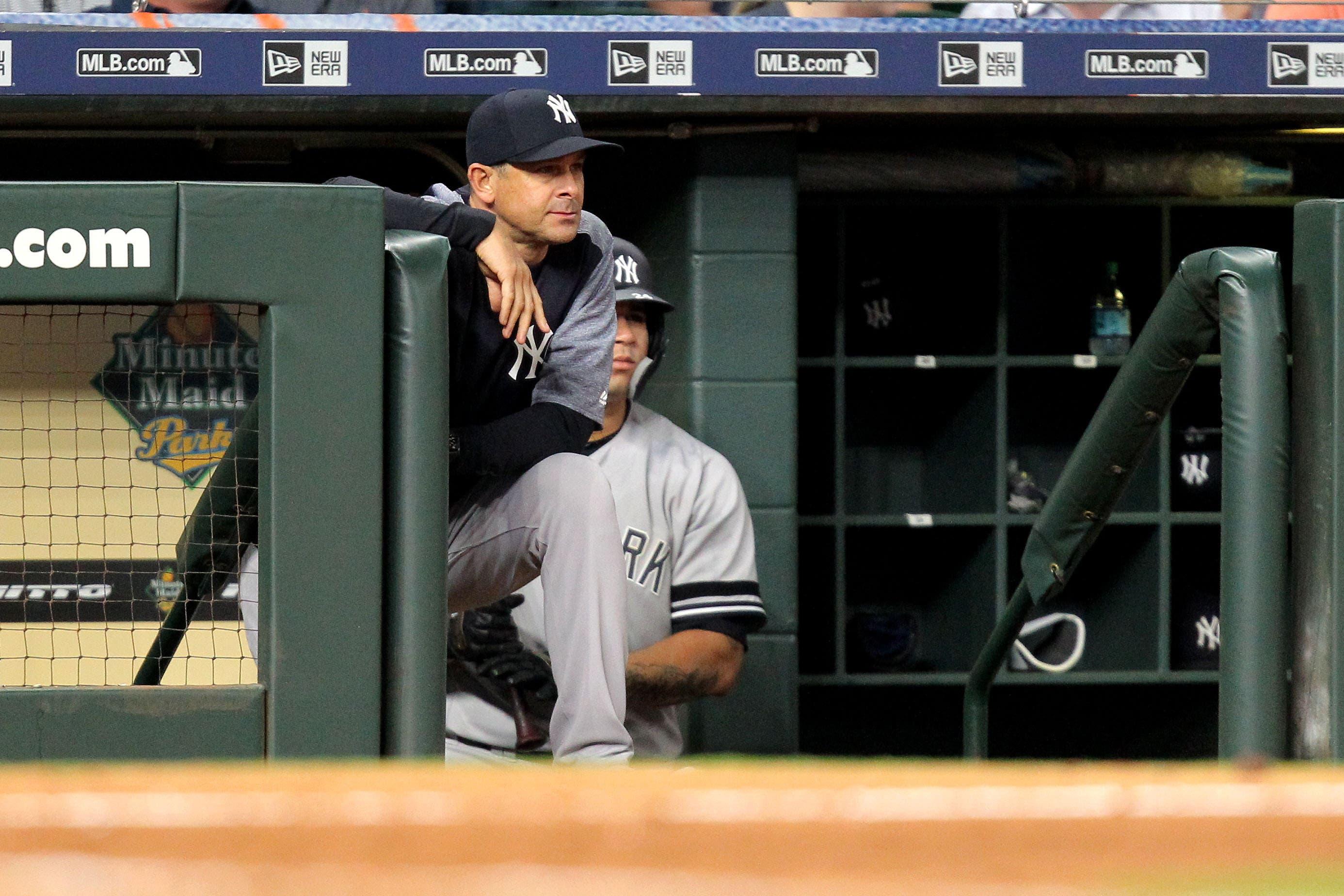 New York Yankees manager Aaron Boone watches the game from the dugout against the Houston Astros during the eighth inning at Minute Maid Park. / Erik Williams/USA TODAY Sports