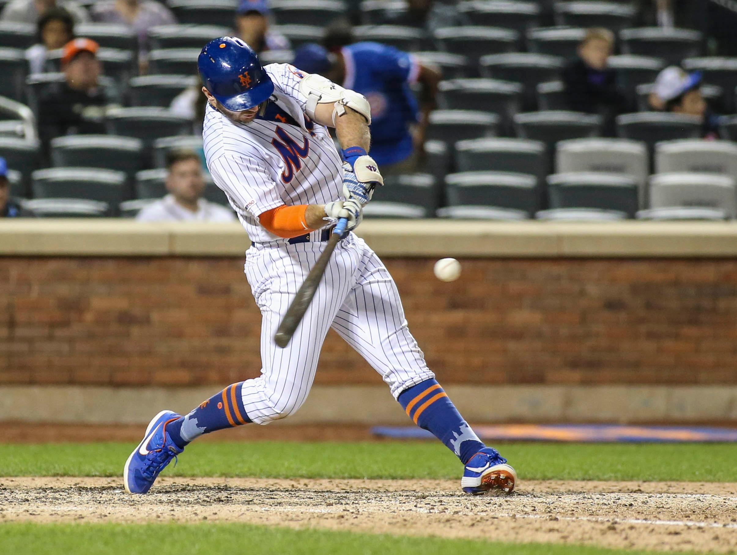 Jun 30, 2019; New York City, NY, USA; New York Mets first baseman Pete Alonso (20) hits an RBI single in the eighth inning against the Atlanta Braves at Citi Field. Mandatory Credit: Wendell Cruz-USA TODAY Sports