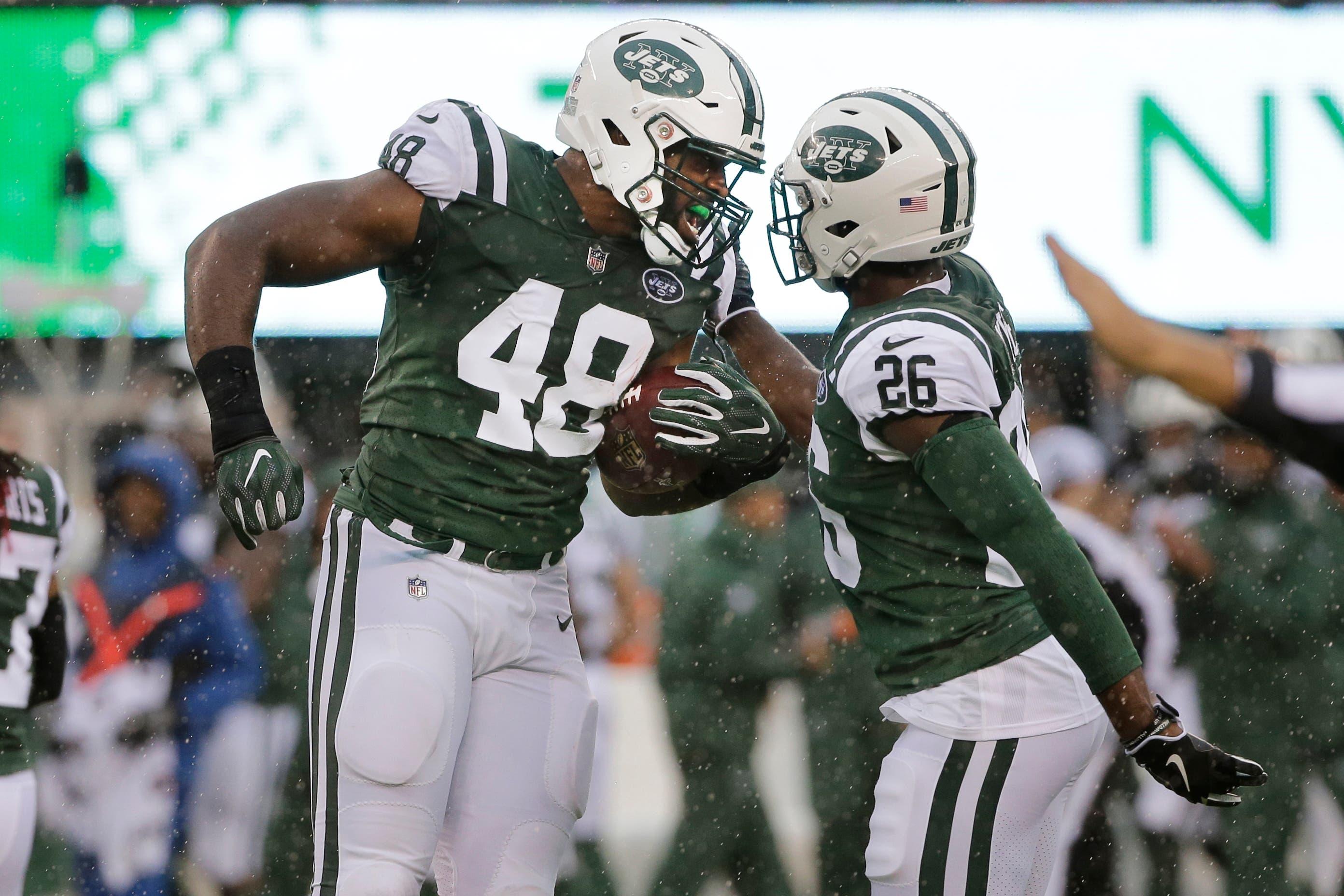 New York Jets outside linebacker Jordan Jenkins (48) celebrates with teammates Marcus Maye (26) after recovering a fumble during the first half of an NFL football game against the Atlanta Falcons Sunday, Oct. 29, 2017, in East Rutherford, N.J. (AP Photo/Seth Wenig) / Seth Wenig/AP