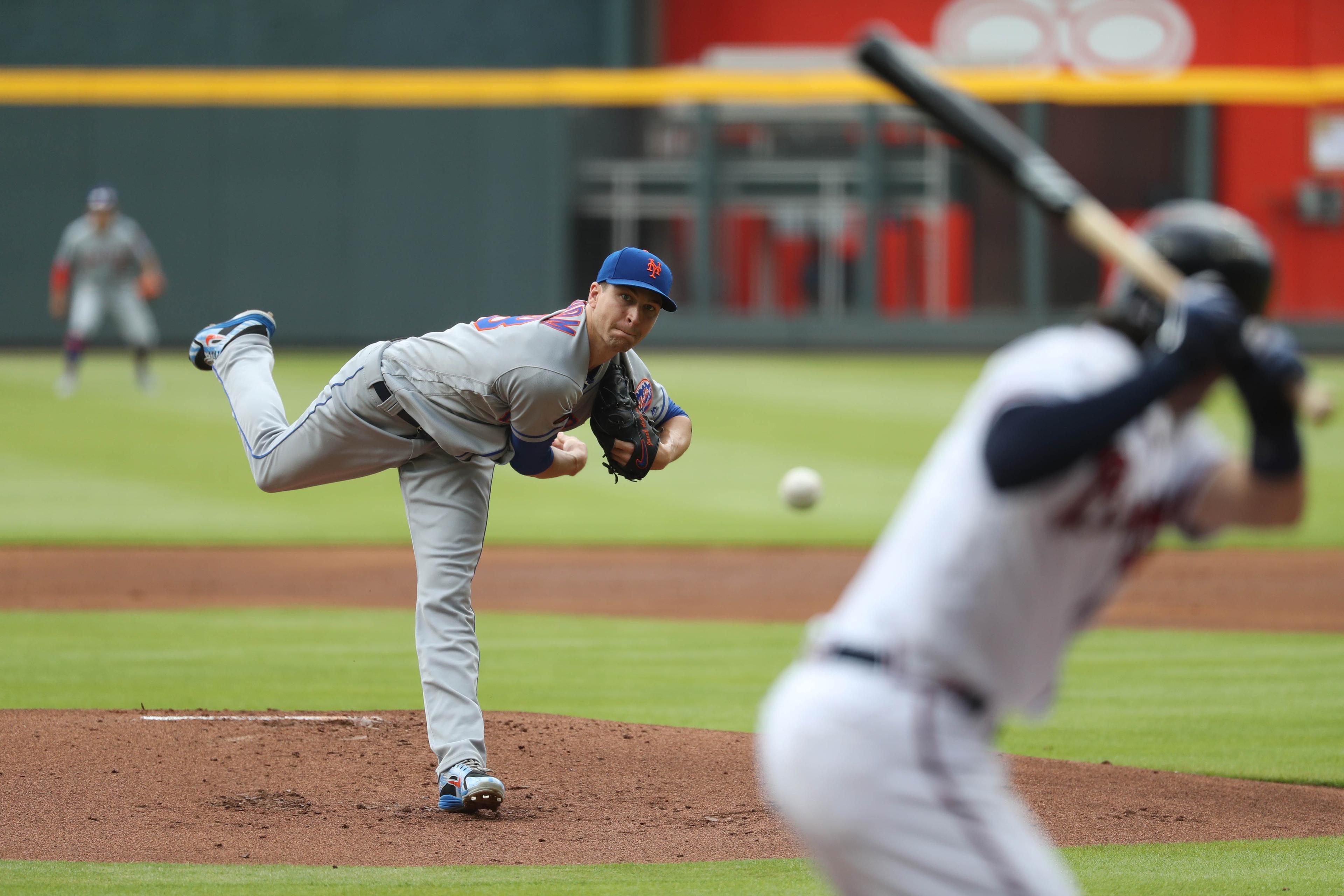 Jun 13, 2018; Atlanta, GA, USA; New York Mets starting pitcher Jacob deGrom (48) delivers a pitch to Atlanta Braves shortstop Dansby Swanson (7) in the first inning at SunTrust Park. Mandatory Credit: Jason Getz-USA TODAY Sports