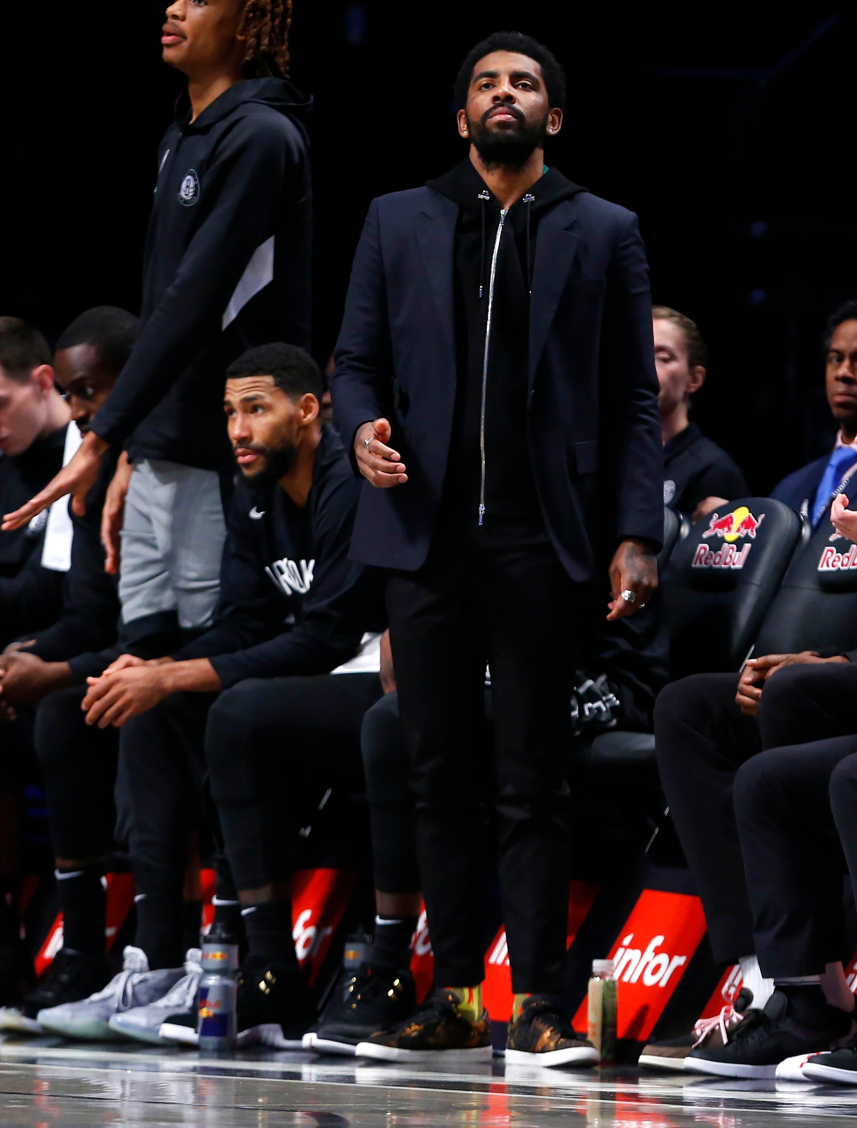 Nov 18, 2019; Brooklyn, NY, USA; Brooklyn Nets guard Kyrie Irving (11) watches game against the Indiana Pacers from the bench during the second half at Barclays Center. Mandatory Credit: Noah K. Murray-USA TODAY Sports / Noah K. Murray