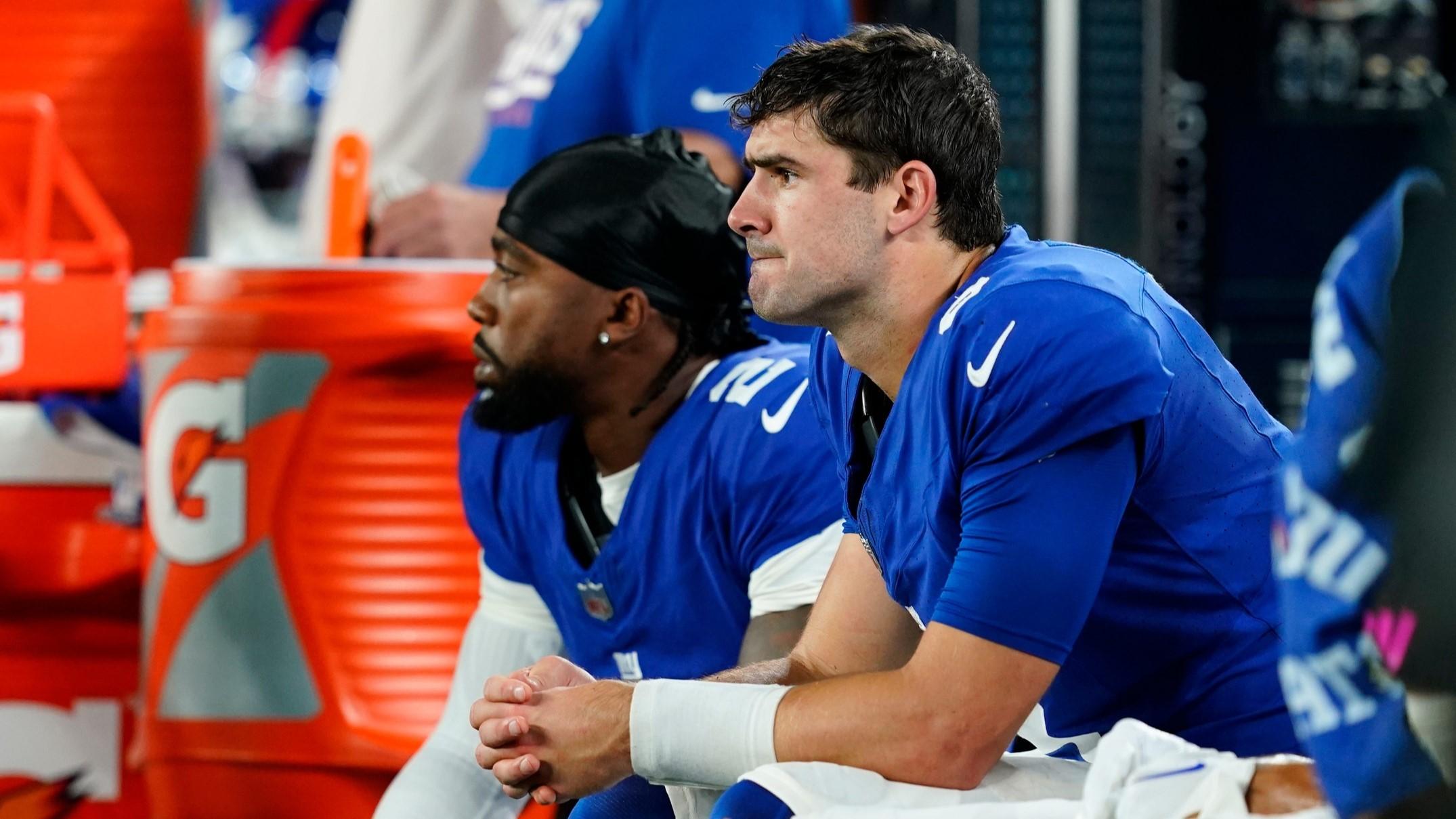 New York Giants quarterback Daniel Jones, right, sits with quarterback Tyrod Taylor (2) in the second half. The Seahawks defeat the Giants, 24-3, at MetLife Stadium on Monday, Oct. 2, 2023, in East Rutherford. / Danielle Parhizkaran/NorthJersey.com / USA TODAY NETWORK
