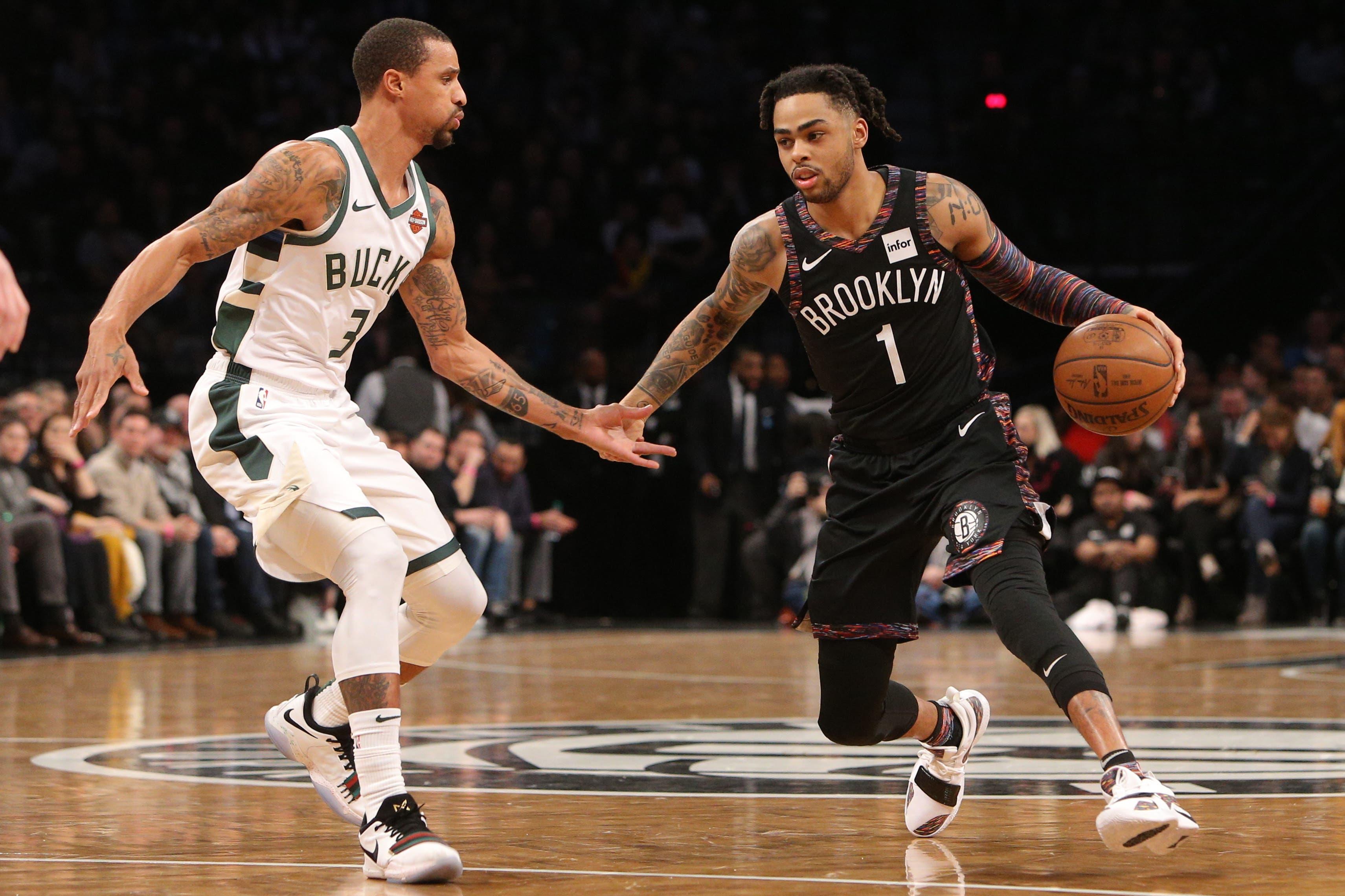 Feb 4, 2019; Brooklyn, NY, USA; Brooklyn Nets point guard D'Angelo Russell (1) controls the ball against Milwaukee Bucks guard George Hill (3) during the first quarter at Barclays Center. Mandatory Credit: Brad Penner-USA TODAY Sports / Brad Penner