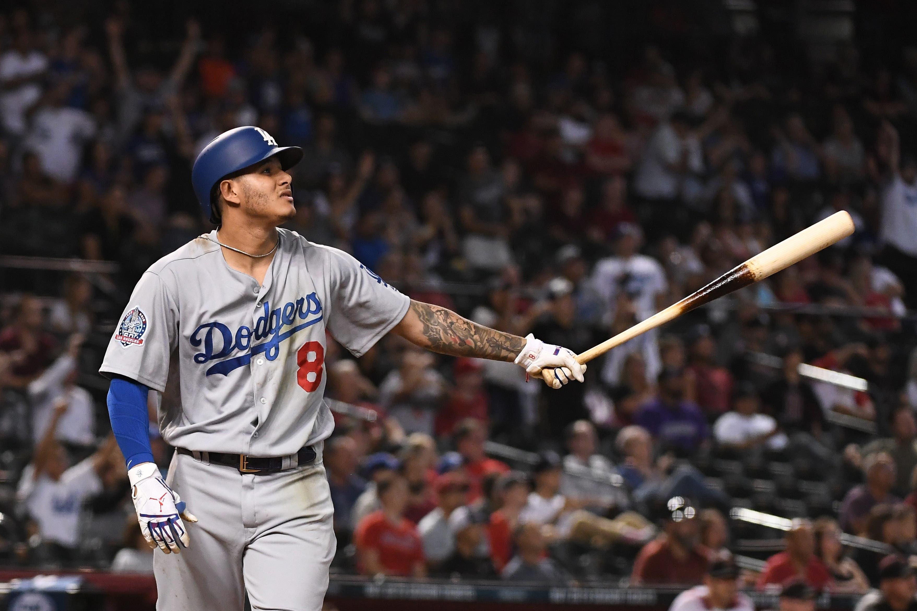 Los Angeles Dodgers shortstop Manny Machado hits an RBI double during the ninth inning against the Arizona Diamondbacks at Chase Field. / Jennifer Stewart-USA TODAY Sports