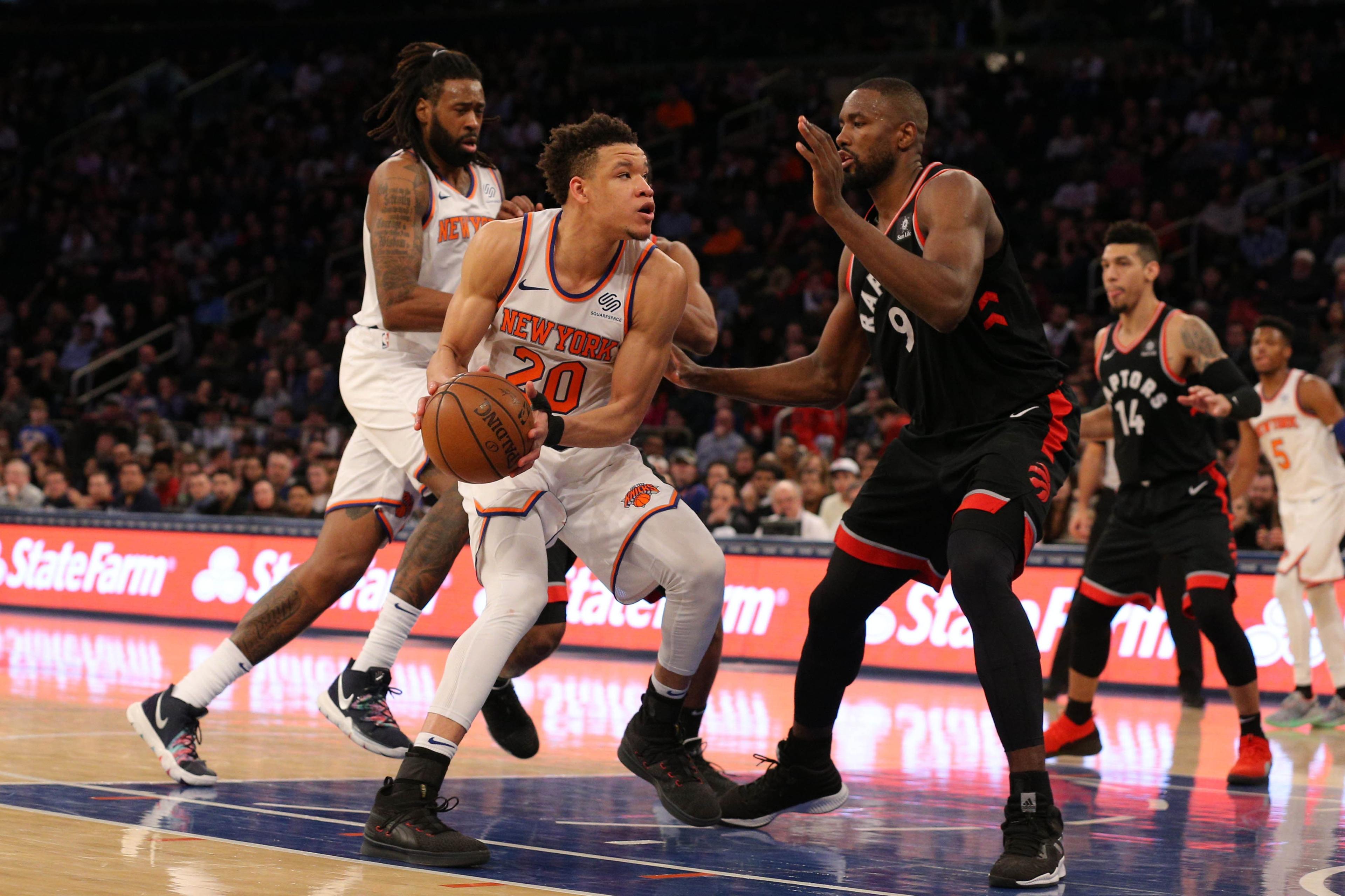 Feb 9, 2019; New York, NY, USA; New York Knicks forward Kevin Knox (20) drives to the basket against Toronto Raptors forward Serge Ibaka (9) during the fourth quarter at Madison Square Garden. Mandatory Credit: Brad Penner-USA TODAY Sports / Brad Penner