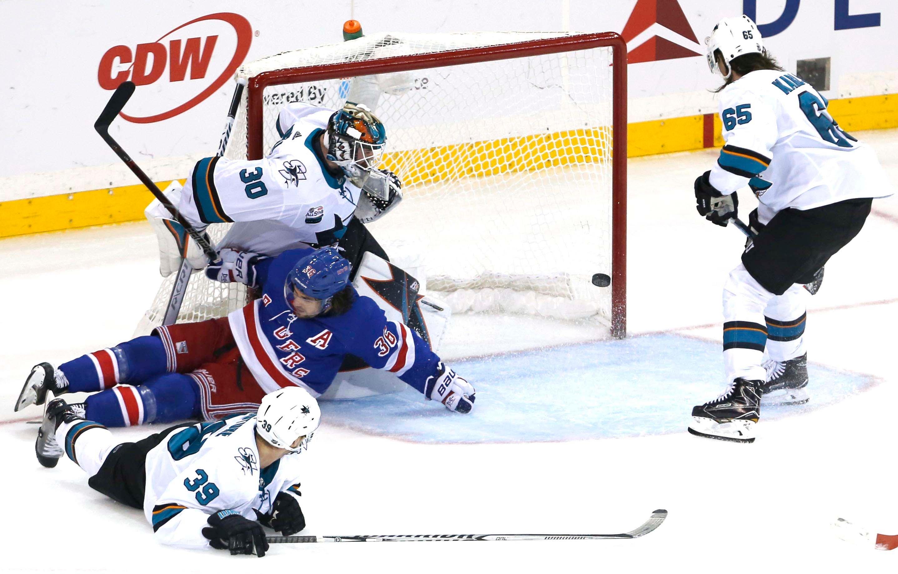 Oct 11, 2018; New York, NY, USA; A shot by New York Rangers defenseman Brady Skjei (76) (not pictured) gets by San Jose Sharks goaltender Aaron Dell (30) to win the game in overtime at Madison Square Garden. The New York Rangers won 3-2 .Mandatory Credit: Noah K. Murray-USA TODAY Sports