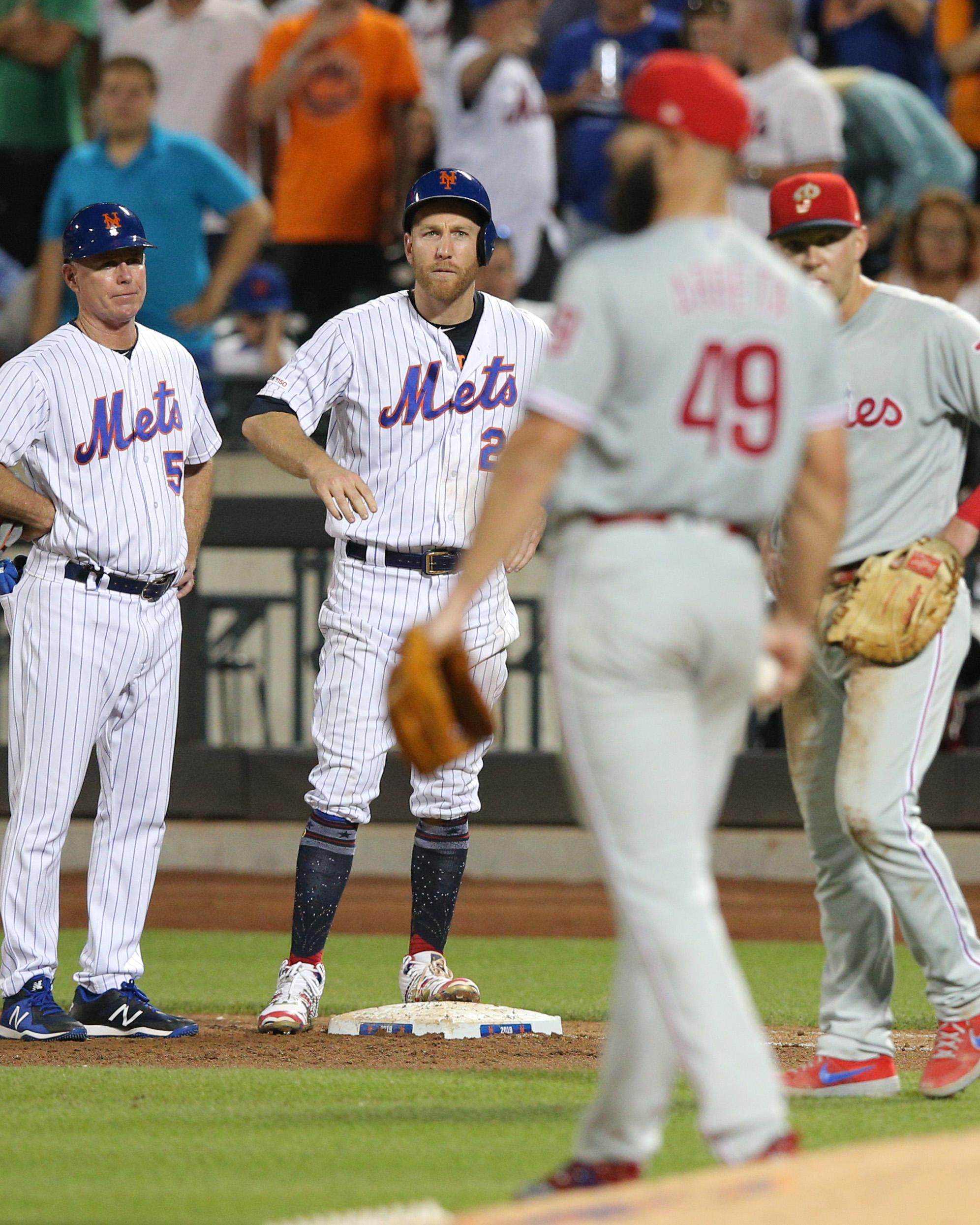 Jul 6, 2019; New York City, NY, USA; New York Mets third baseman Todd Frazier (21) reacts after being hit by a pitch by Phillies starting pitcher Jake Arrieta (49) during the fifth inning at Citi Field. Mandatory Credit: Brad Penner-USA TODAY Sports