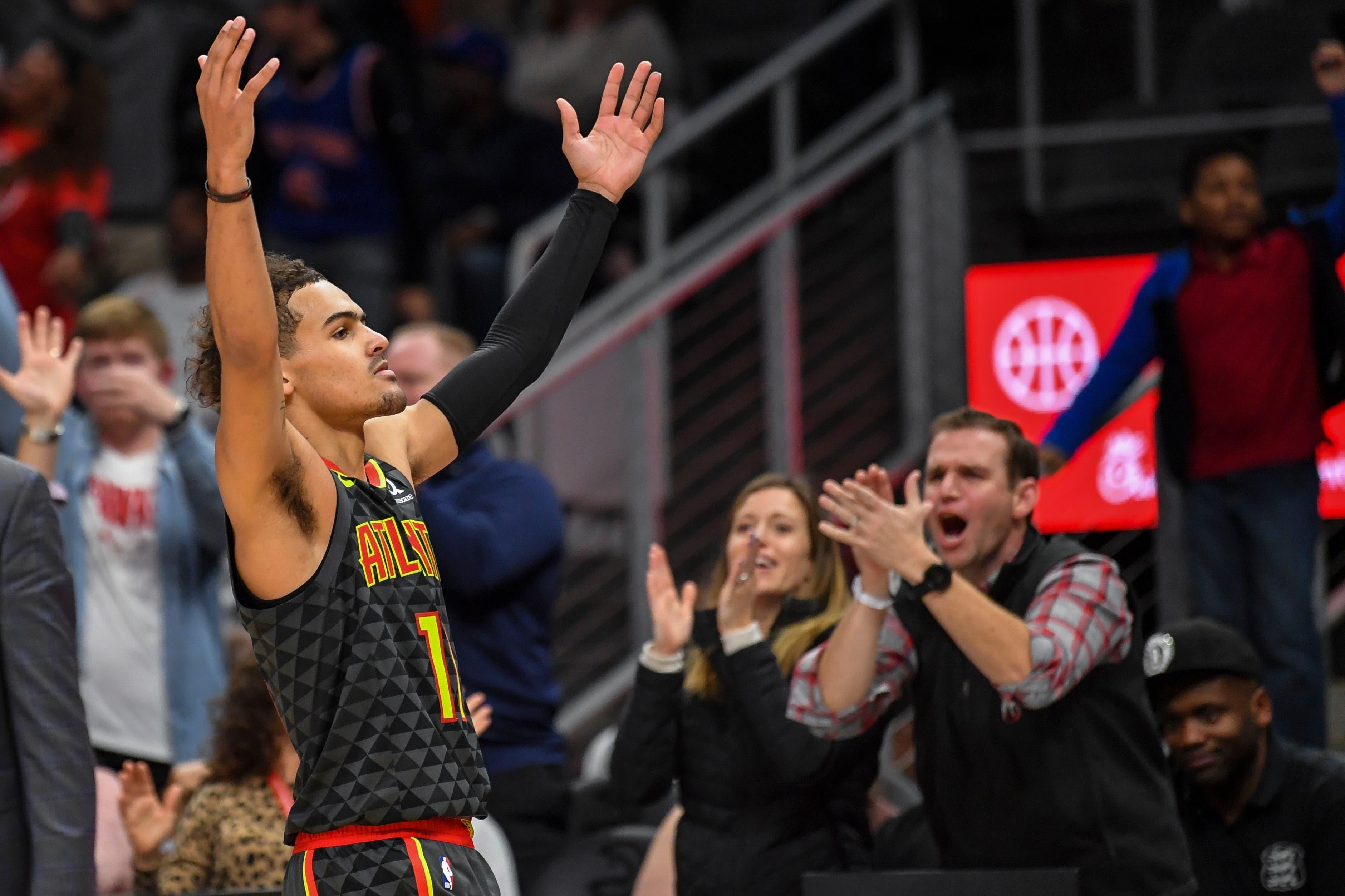 Feb 9, 2020; Atlanta, Georgia, USA; Atlanta Hawks guard Trae Young (11) reacts with fans after hitting a three point shot in the second overtime against the New York Knicks at State Farm Arena. Mandatory Credit: Dale Zanine-USA TODAY Sports / DALE ZANINE