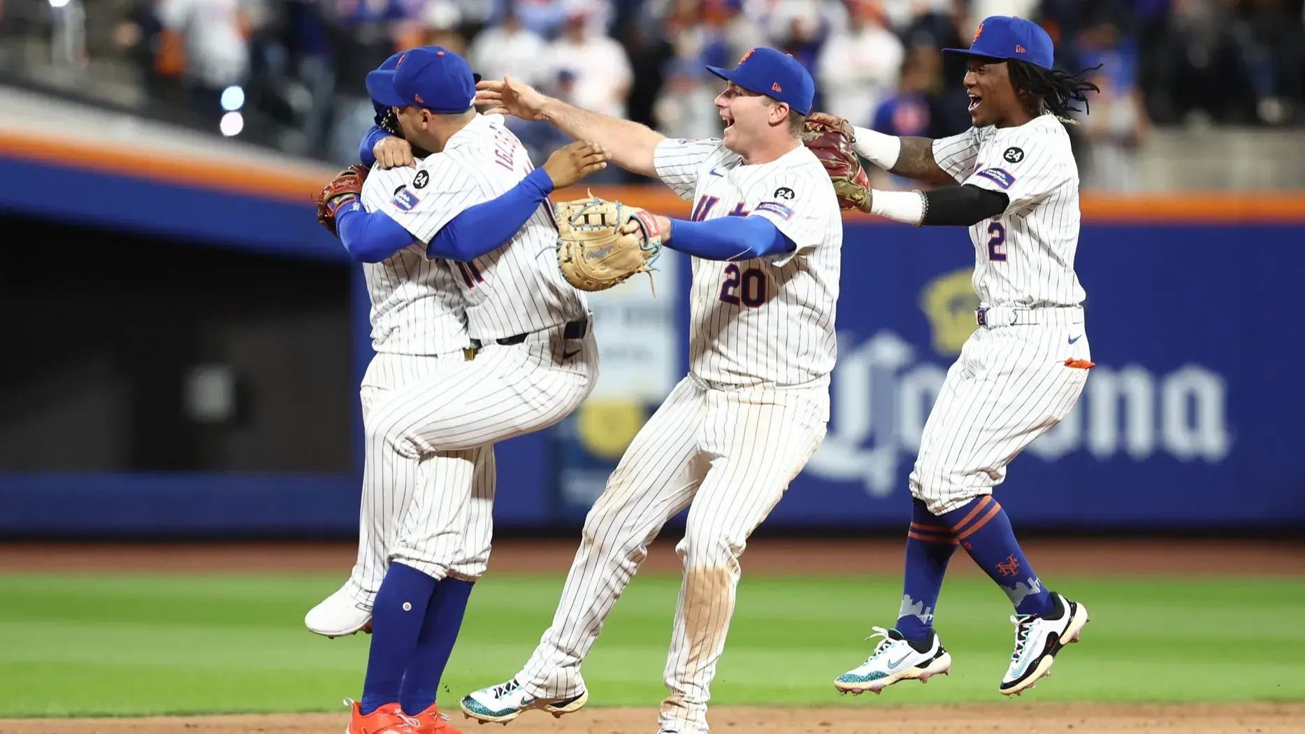 Oct 9, 2024; New York, New York, USA; New York Mets players including first baseman Pete Alonso (20), shortstop Luisangel Acuna (2), second baseman Jose Iglesias (11) and shortstop Francisco Lindor (12) celebrate defeating the Philadelphia Phillies in game four of the NLDS for the 2024 MLB Playoffs at Citi Field. / Wendell Cruz-Imagn Images