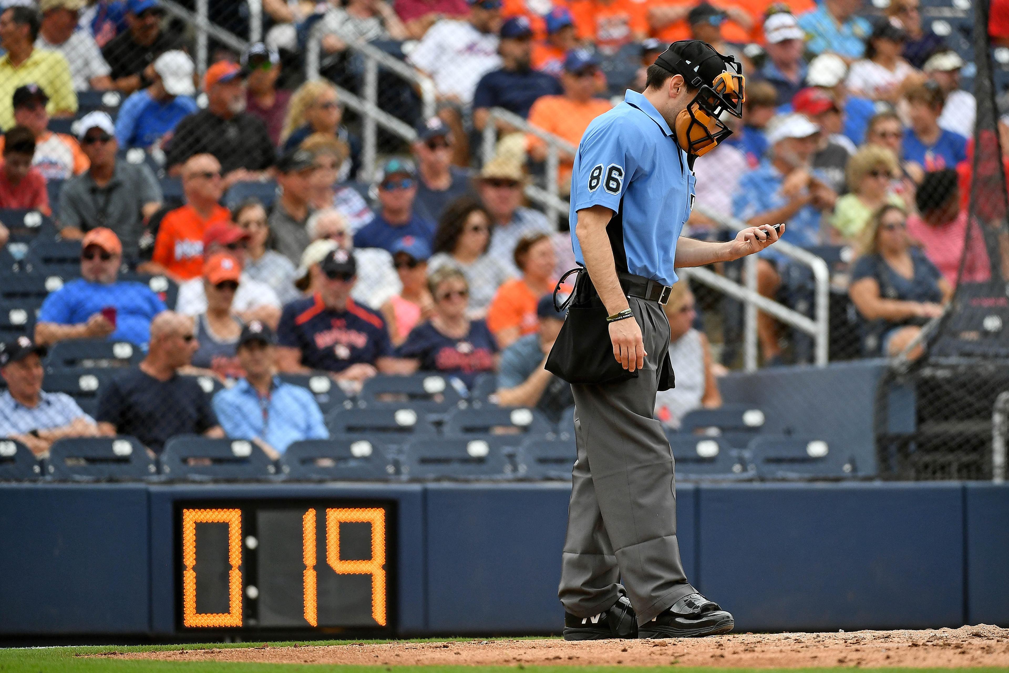 Feb 25, 2019; West Palm Beach, FL, USA; Home plate umpire David Rackley (86) stands in front of the pitch clock during a spring training game between the Houston Astros and the New York Mets at FITTEAM Ballpark of the Palm Beaches. Mandatory Credit: Jasen Vinlove-USA TODAY Sports / Jasen Vinlove