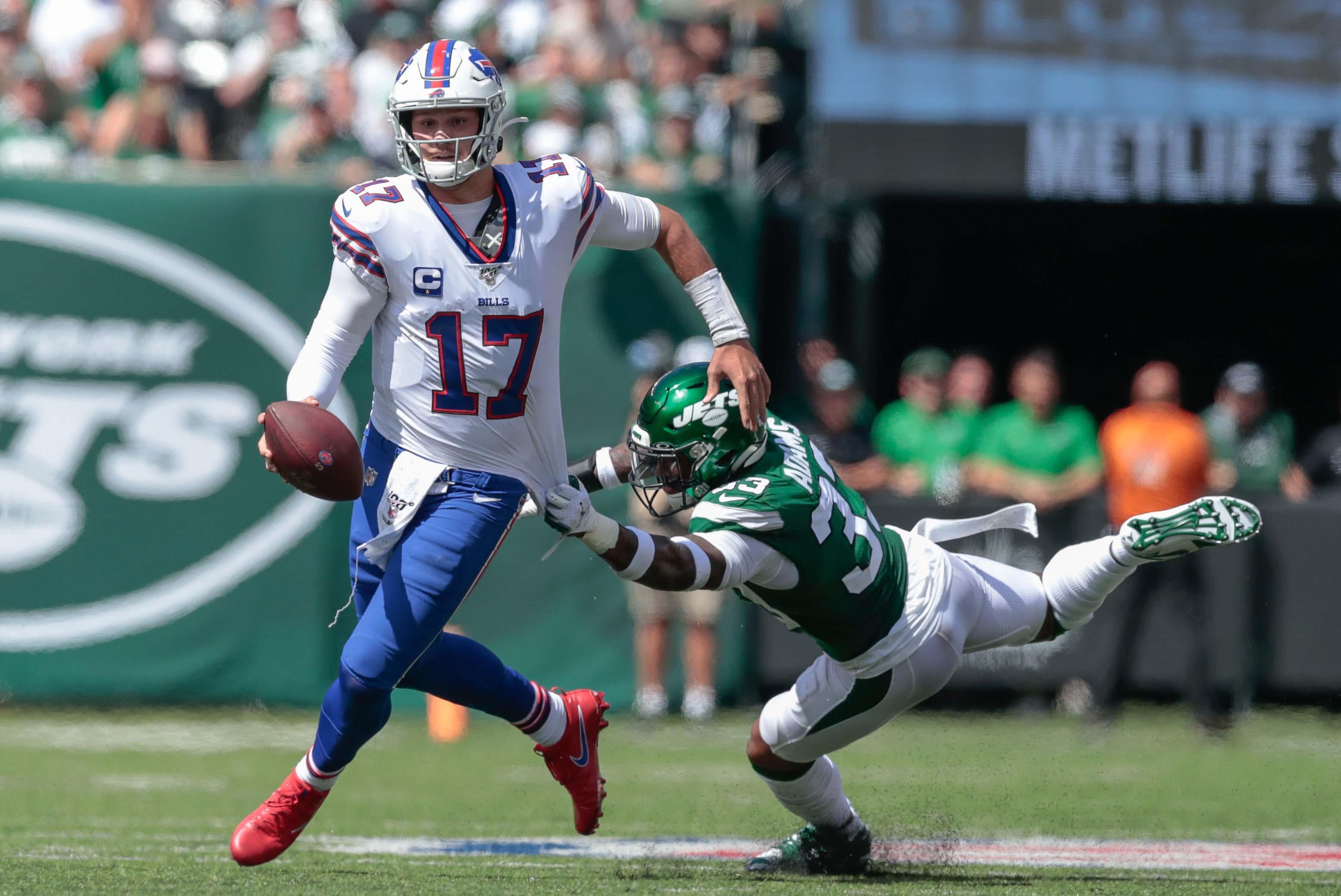 Sep 8, 2019; East Rutherford, NJ, USA; Buffalo Bills quarterback Josh Allen (17) carries the ball as New York Jets strong safety Jamal Adams (33) tackles during the first half at MetLife Stadium. Mandatory Credit: Vincent Carchietta-USA TODAY Sports