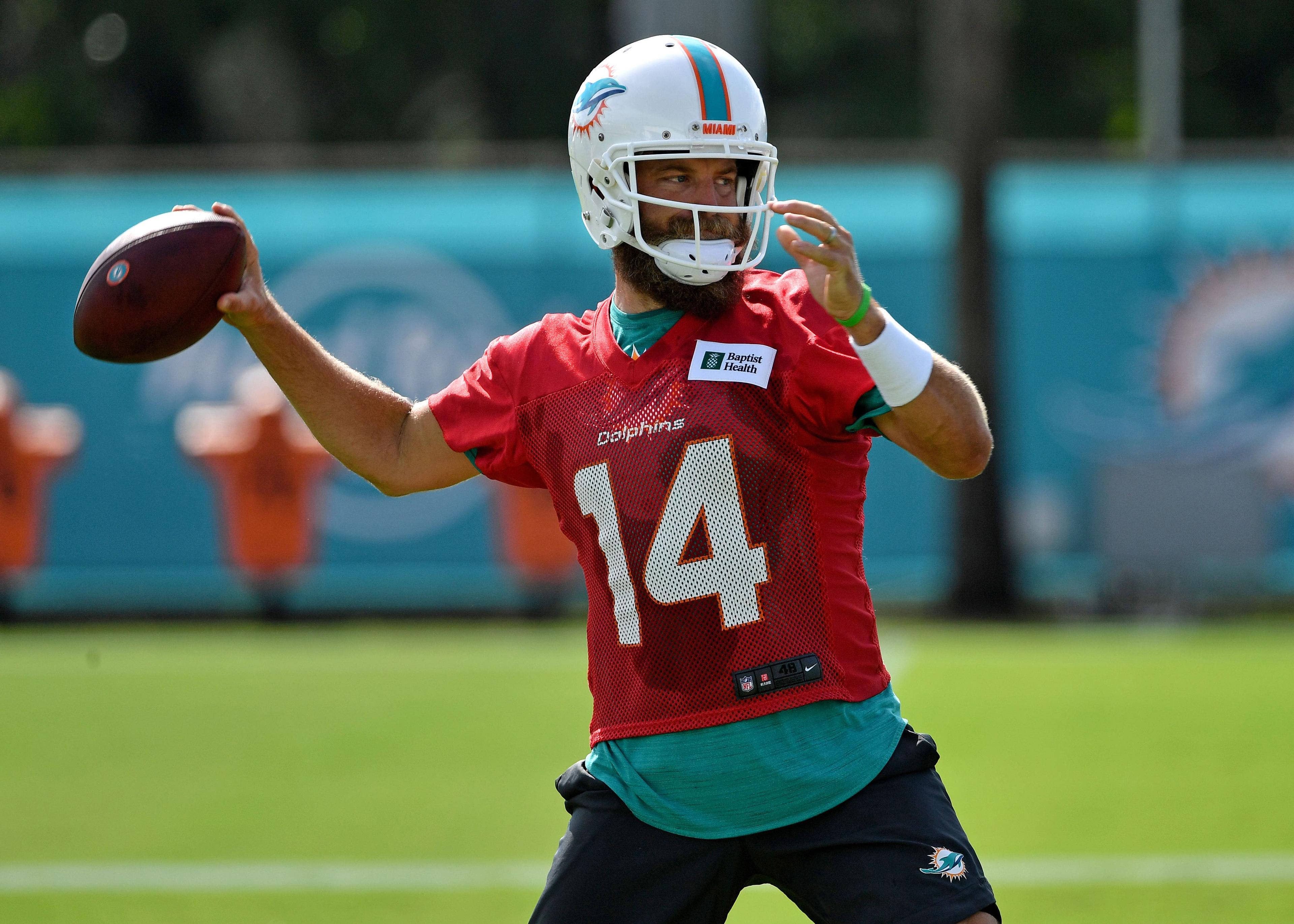 Jul 25, 2019; Davie, FL, USA; Miami Dolphins quarterback Ryan Fitzpatrick (14) during practice drills at Baptist Health Training Facility. Mandatory Credit: Steve Mitchell-USA TODAY Sports / Steve Mitchell