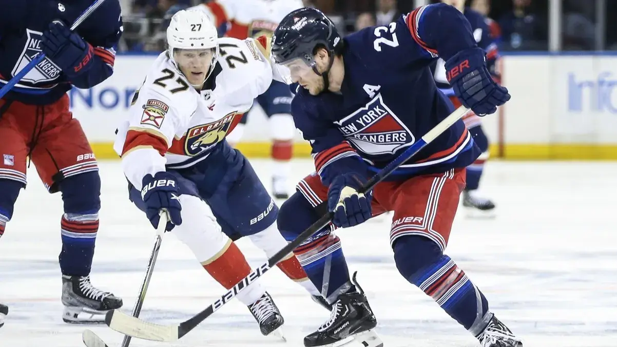 Mar 23, 2024; New York, New York, USA; Florida Panthers center Eetu Luostarinen (27) and New York Rangers defenseman Adam Fox (23) battle for control of the puck in the third period at Madison Square Garden. / Wendell Cruz-USA TODAY Sports