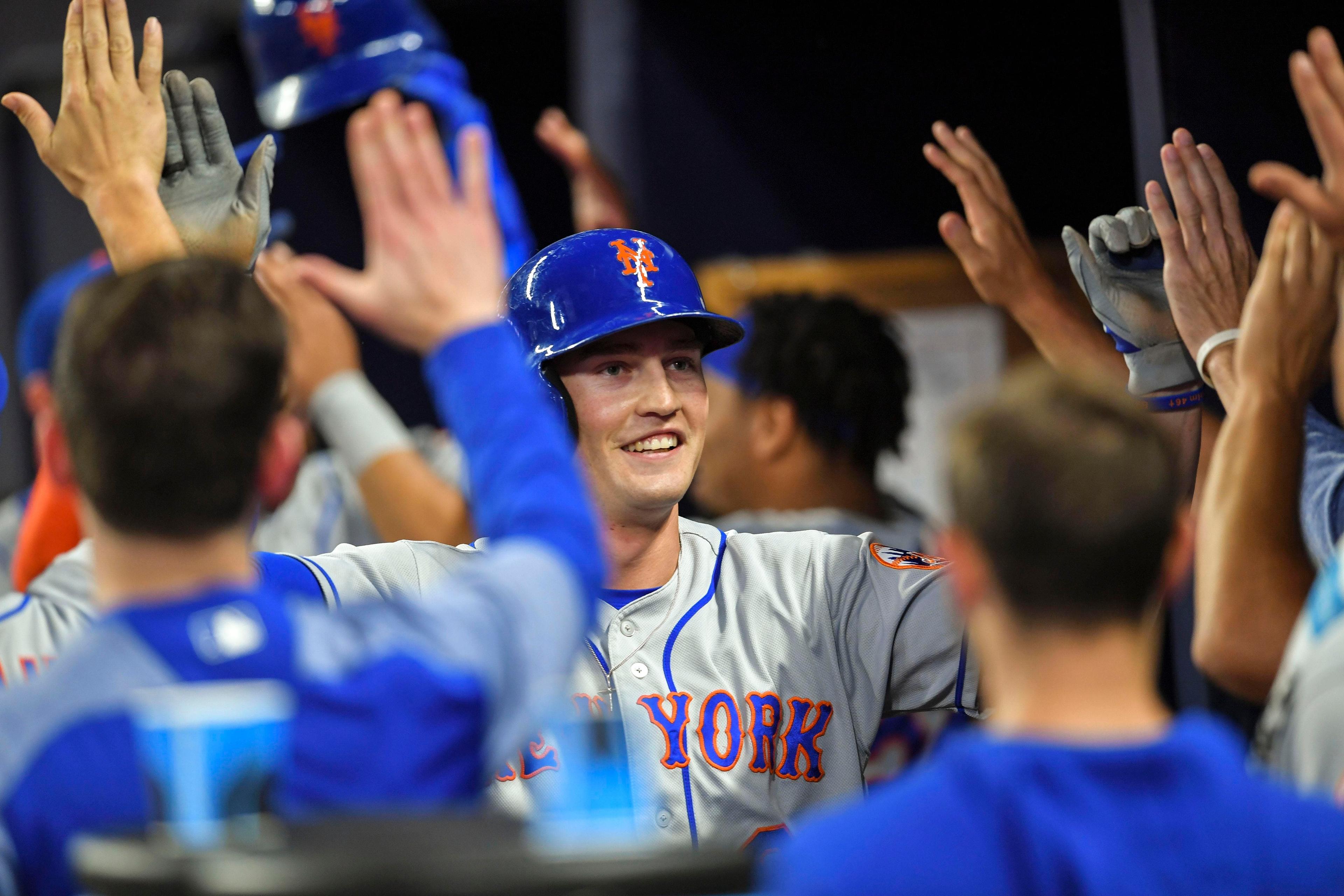 Apr 12, 2019; Atlanta, GA, USA; New York Mets Brandon Nimmo (9) gets high fives after scoring against the Atlanta Braves during the fourth inning at SunTrust Park. Mandatory Credit: Dale Zanine-USA TODAY Sports / Dale Zanine