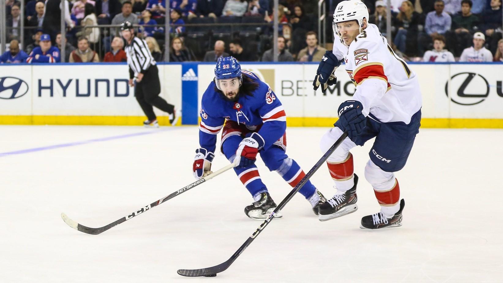 Mar 4, 2024; New York, New York, USA; New York Rangers center Mika Zibanejad (93) and Florida Panthers center Sam Reinhart (13) chases the puck in the first period at Madison Square Garden / Wendell Cruz-USA TODAY Sports