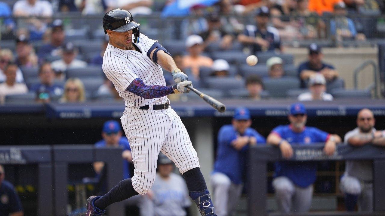 New York Yankees right fielder Giancarlo Stanton (27) hits a home run against the Chicago Cubs during the first inning at Yankee Stadium. / Gregory Fisher-USA TODAY Sports