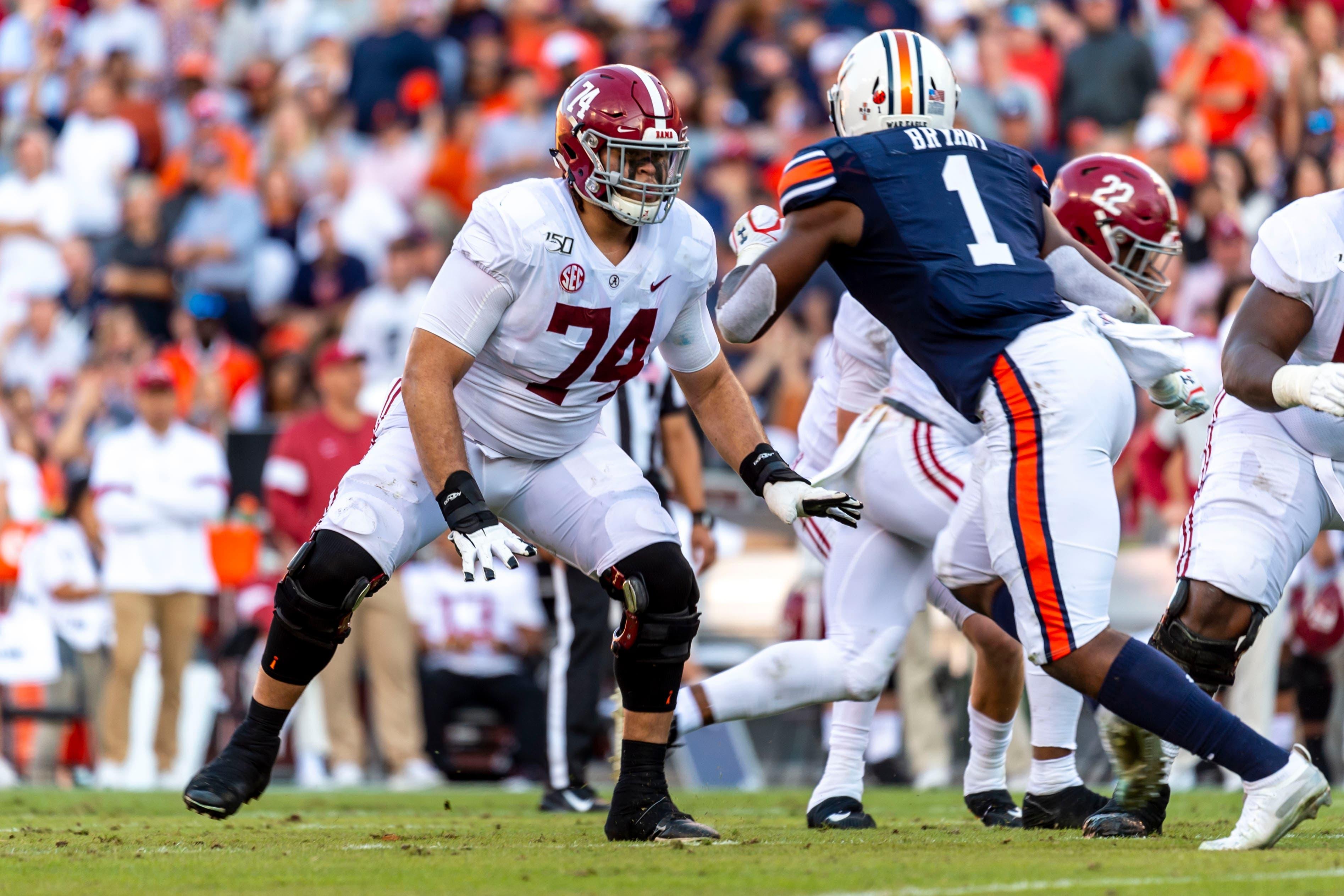 Alabama offensive lineman Jedrick Wills Jr. (74) sets up to block against Auburn defensive lineman Big Kat Bryant (1) during the first half of an NCAA college football game, Saturday, Nov. 30, 2019, in Auburn, Ala. (AP Photo/Vasha Hunt) / Vasha Hunt/AP