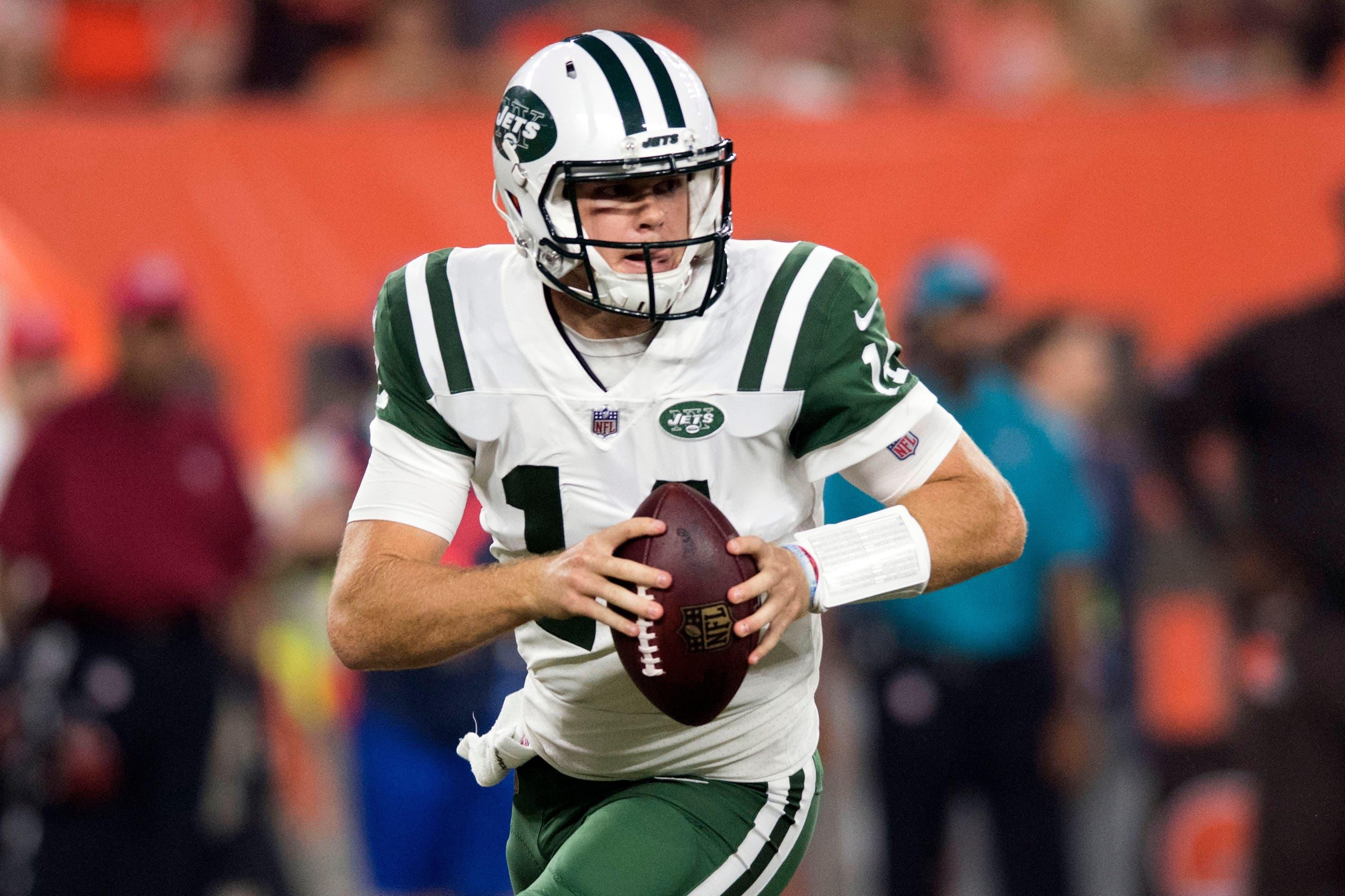 Sep 20, 2018; Cleveland, OH, USA; New York Jets quarterback Sam Darnold (14) rolls out to pass during the first quarter against the Cleveland Browns at FirstEnergy Stadium. Mandatory Credit: Ken Blaze-USA TODAY Sports / Ken Blaze