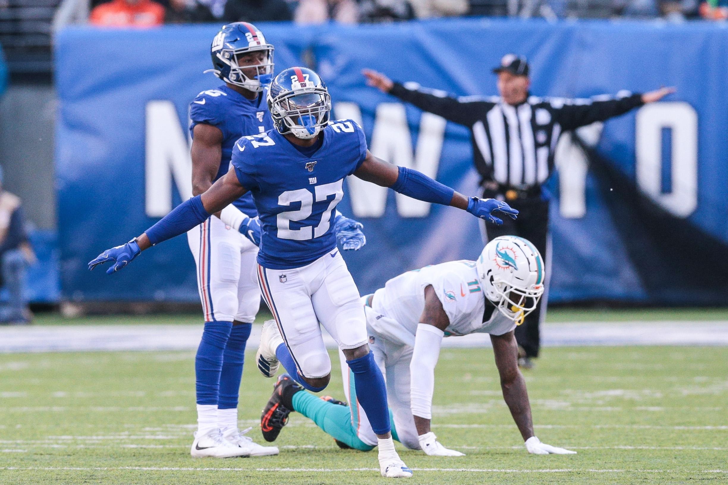 Dec 15, 2019; East Rutherford, NJ, USA; New York Giants cornerback Deandre Baker (27) reacts after breaking up a pass intended for Miami Dolphins wide receiver DeVante Parker (11) during the first half at MetLife Stadium. Mandatory Credit: Vincent Carchietta-USA TODAY Sports