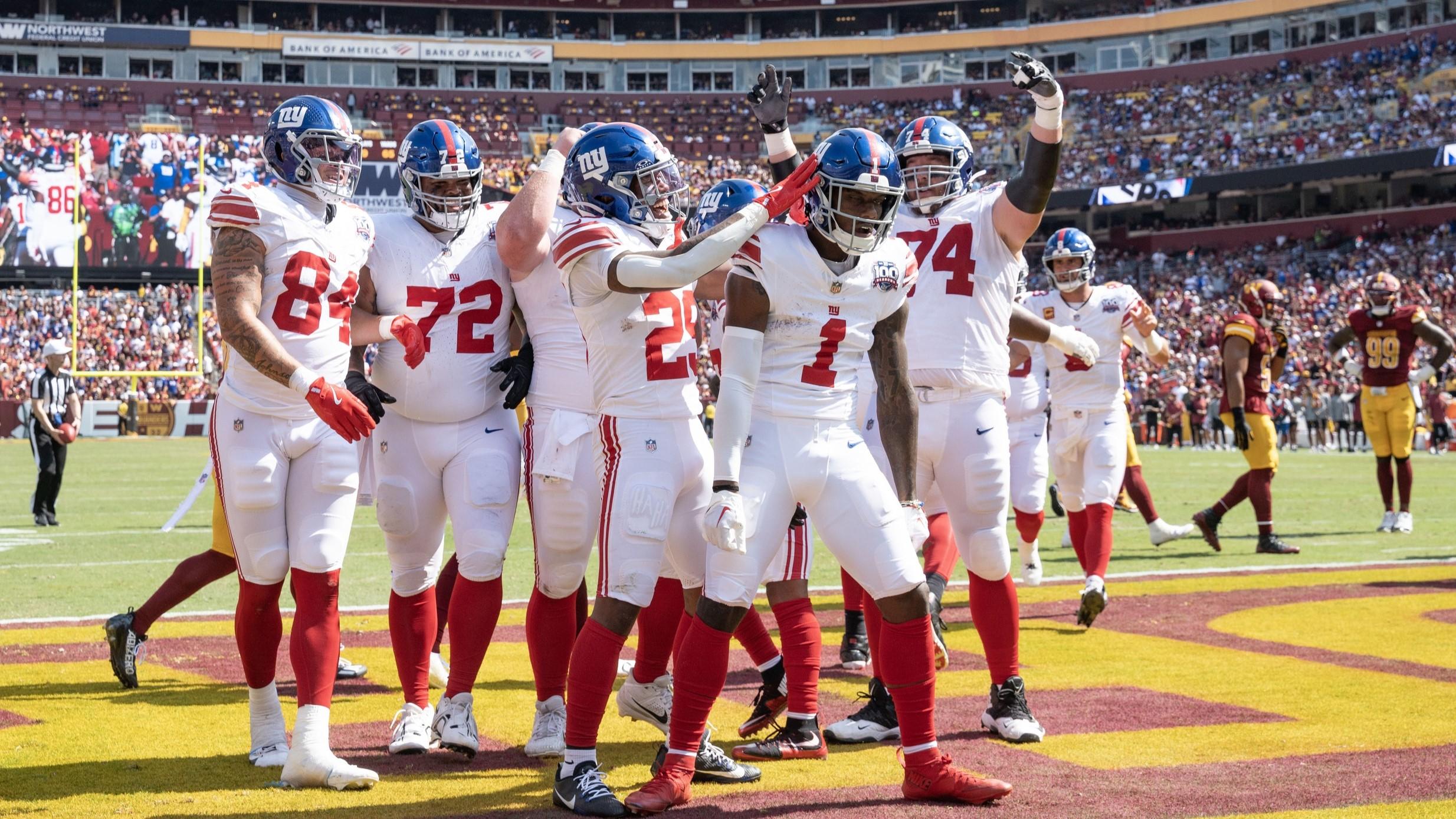 Sep 15, 2024; Landover, Maryland, USA; New York Giants wide receiver Malik Nabers (1) celebrates with teammates after catching a touchdown pass in the game against the Washington Commanders at Commanders Field. 