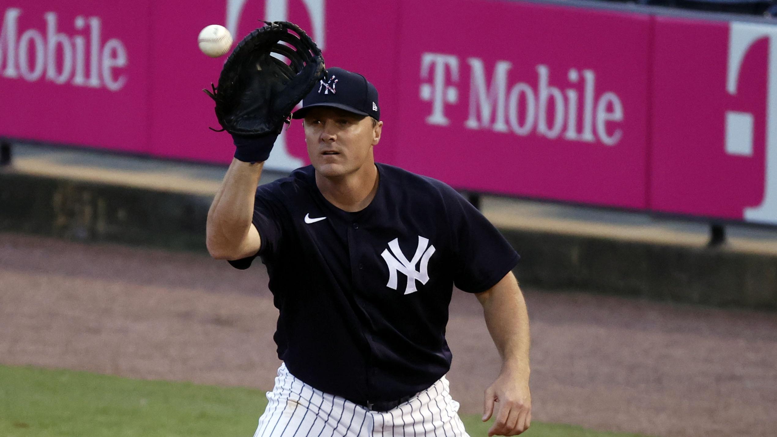 Mar 22, 2021; Tampa, Florida, USA; New York Yankees first baseman Jay Bruce (30) catches the ball for an out against the Philadelphia Phillies at George M. Steinbrenner Field. Mandatory Credit: Kim Klement-USA TODAY Sports / © Kim Klement-USA TODAY Sports