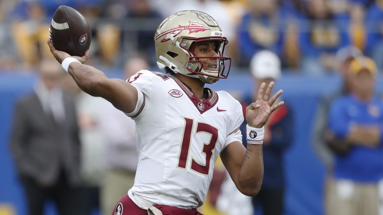 Nov 4, 2023; Pittsburgh, Pennsylvania, USA; Florida State Seminoles quarterback Jordan Travis (13) passes the ball against the Pittsburgh Panthers during the first quarter at Acrisure Stadium. / Charles LeClaire-USA TODAY Sports