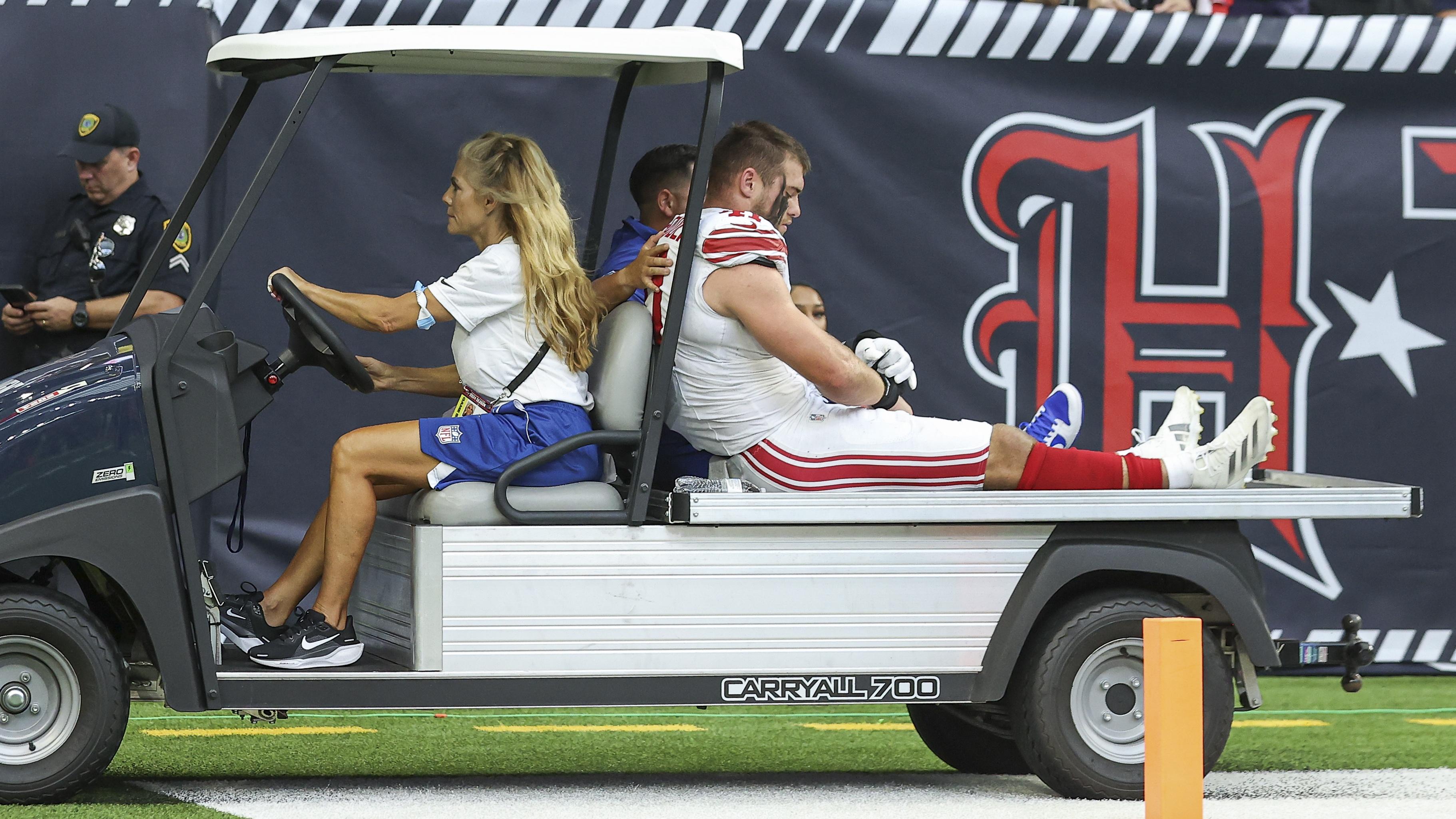 New York Giants linebacker Micah McFadden (41) leaves the game on a cart after an apparent injury during the game against the Houston Texans at NRG Stadium