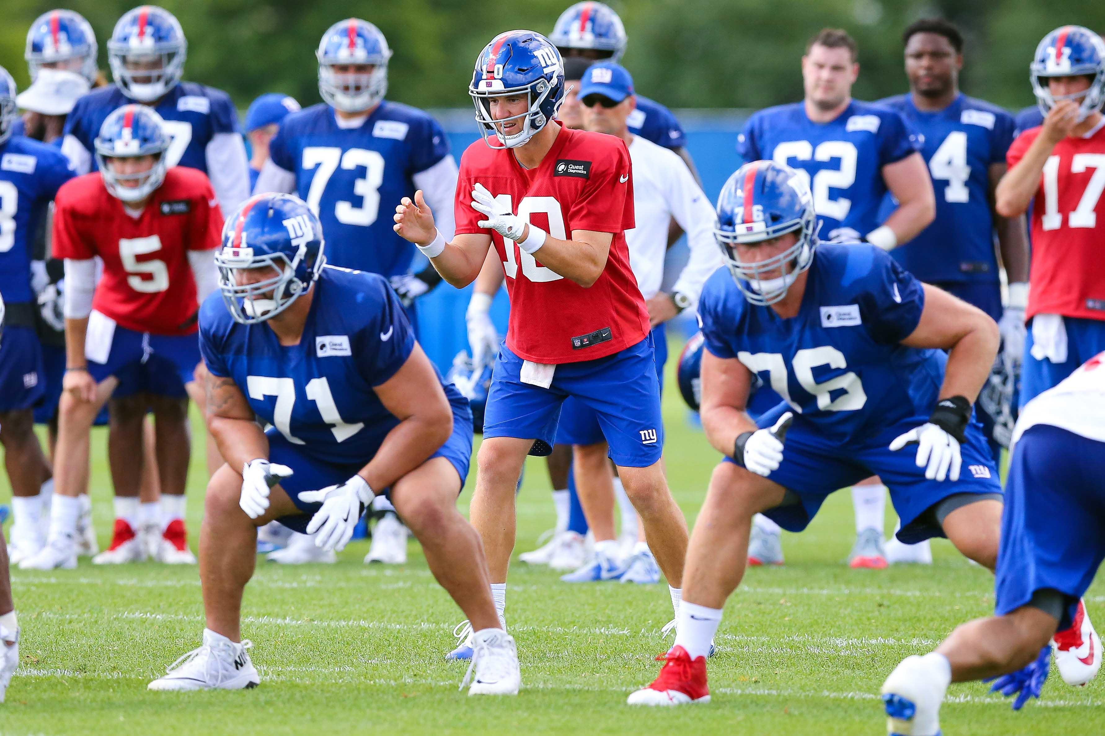 Jul 26, 2018; East Rutherford, NJ, USA; New York Giants quarterback Eli Manning (10) calls signals as offensive guard Will Hernandez (71) and offensive tackle Nate Solder (76) prepare for the snap during training camp at Quest Diagnostics Training Center. Mandatory Credit: Vincent Carchietta-USA TODAY Sports / Vincent Carchietta