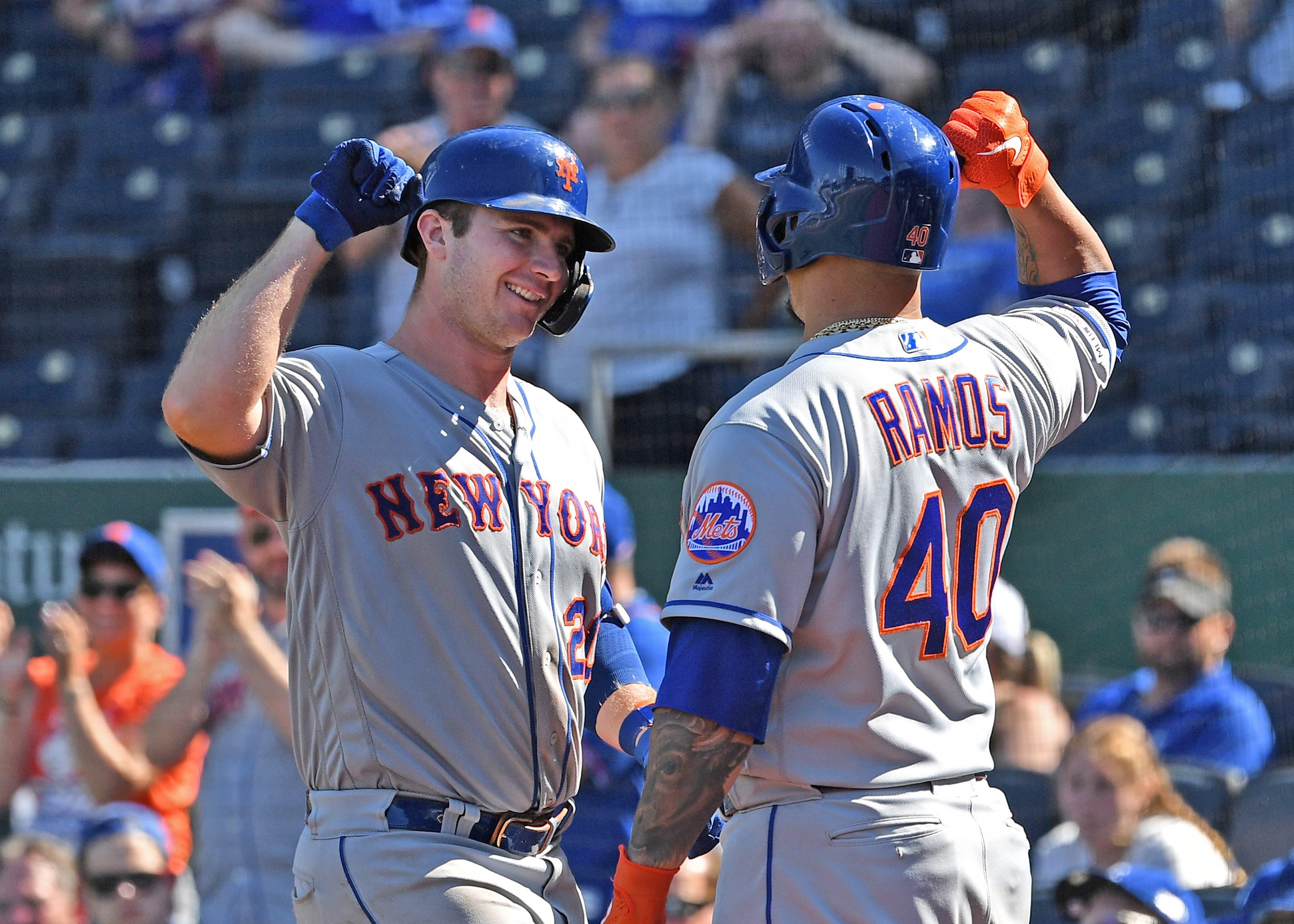 Aug 18, 2019; Kansas City, MO, USA; New York Mets first baseman Pete Alonso (20) celebrates with designated hitter Wilson Ramos (40) after hitting a solo home run during the ninth inning against the Kansas City Royals at Kauffman Stadium. Mandatory Credit: Peter G. Aiken/USA TODAY Sports / Peter Aiken