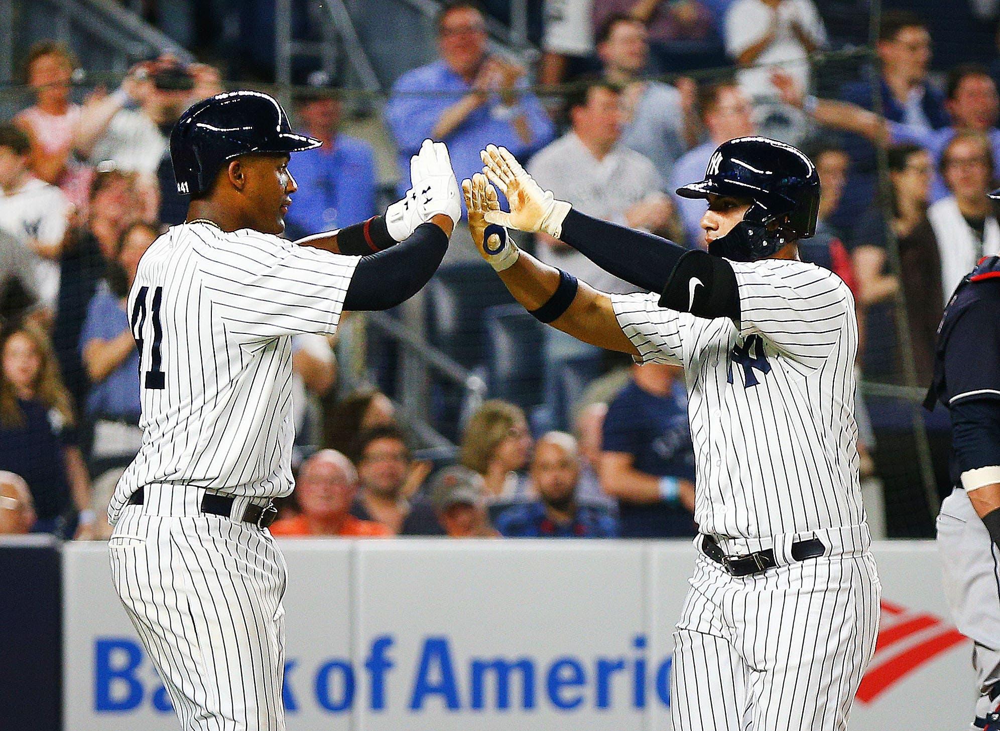 New York Yankees second baseman Gleyber Torres is congratulated by third baseman Miguel Andujar after hitting a three-run home run. / Andy Marlin/USA TODAY Sports