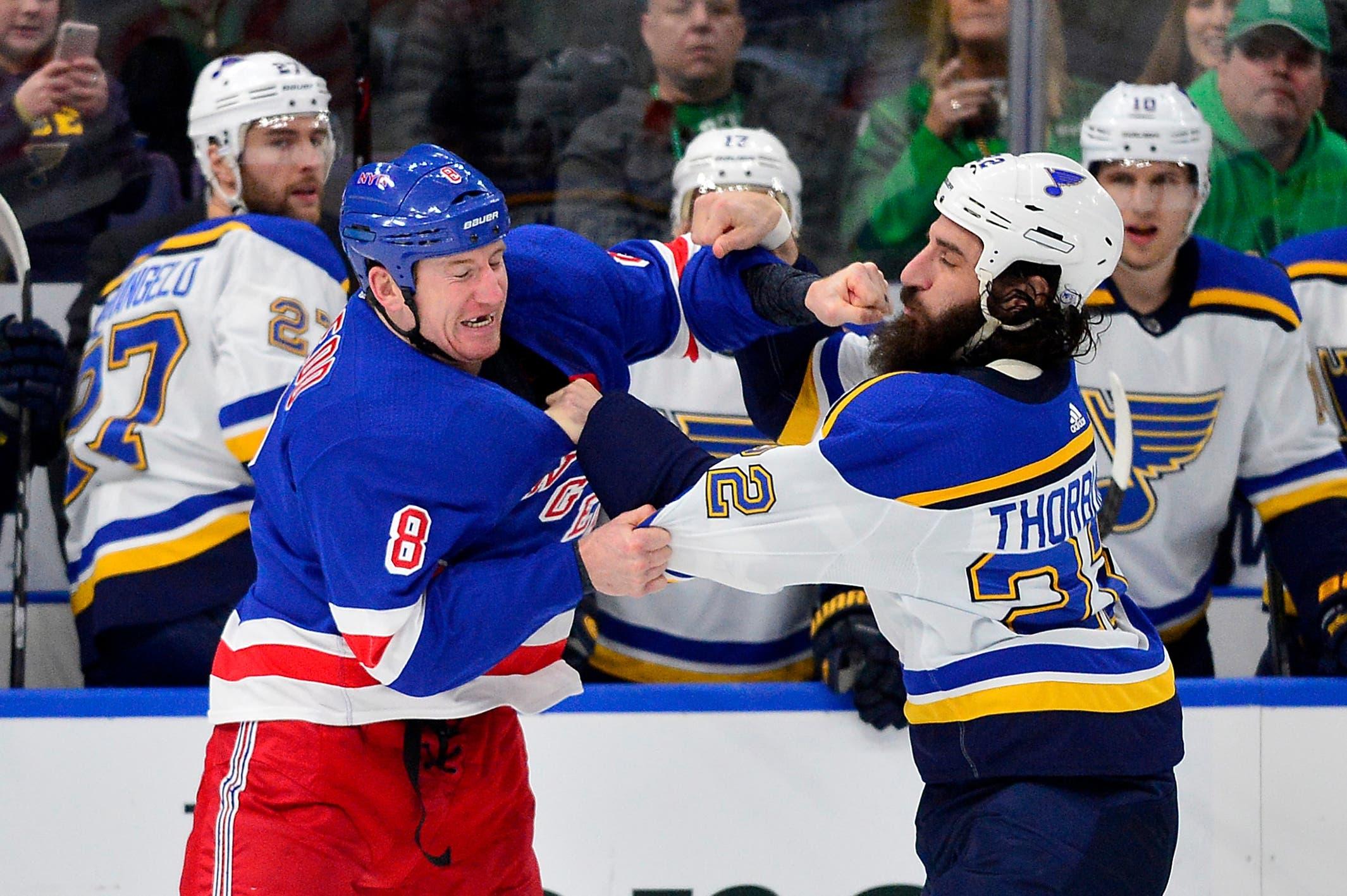 Mar 17, 2018; St. Louis, MO, USA; New York Rangers left wing Cody McLeod (8) and St. Louis Blues right wing Chris Thorburn (22) fight during the first period at Scottrade Center. Mandatory Credit: Jeff Curry-USA TODAY Sports / Jeff Curry