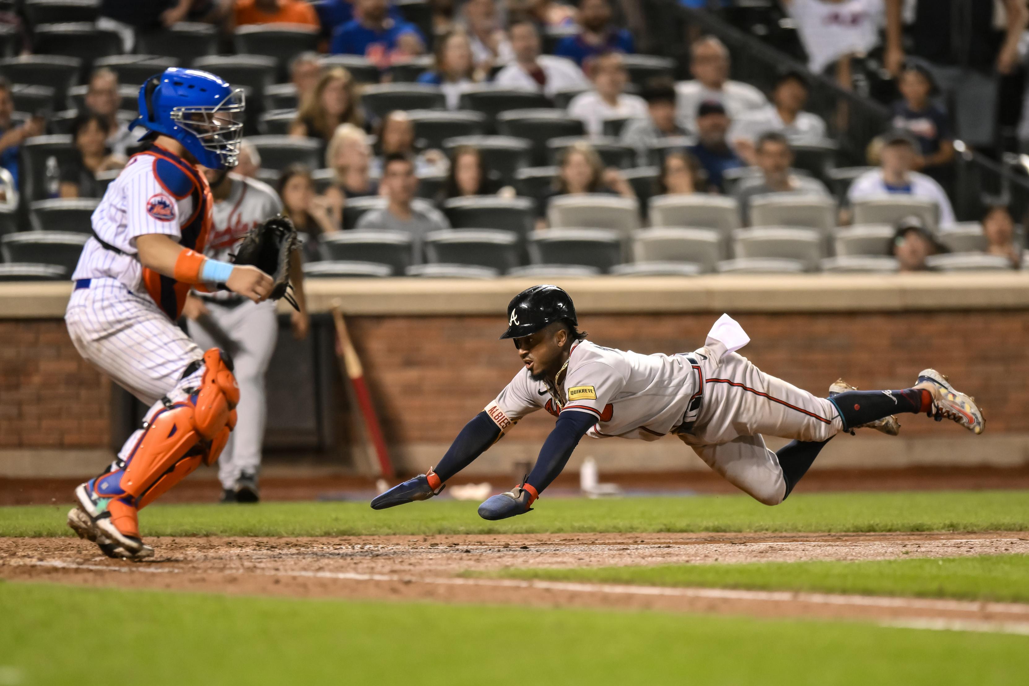 Atlanta Braves second baseman Ozzie Albies (1) scores a run on a RBI single by Atlanta Braves third baseman Austin Riley (not pictured) during the eighth inning at Citi Field. / John Jones-USA TODAY Sports