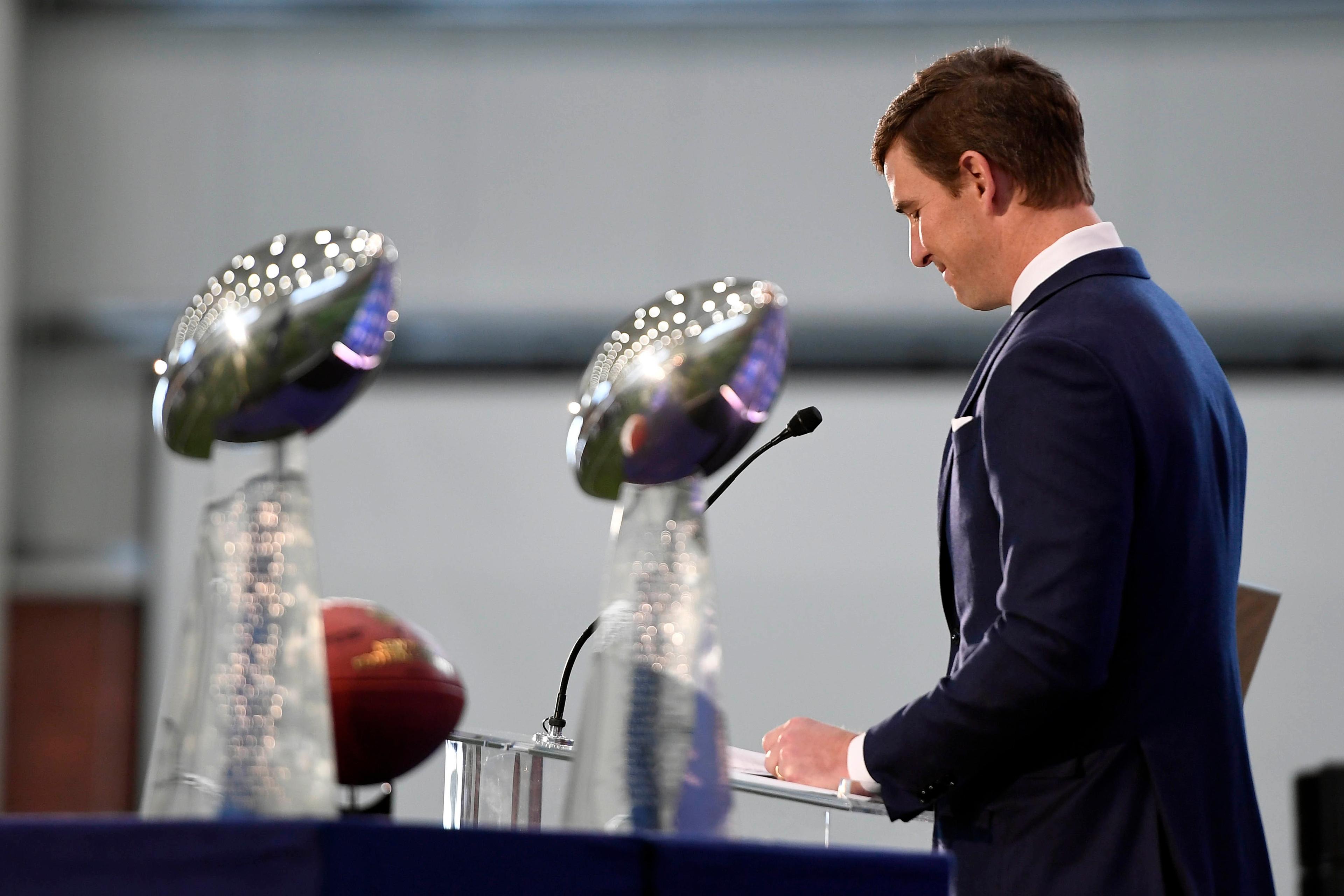 Jan 24, 2020; East Rutherford, New Jersey, USA; New York Giants quarterback Eli Manning announces his retirement with the two Vince Lombardi trophies he won for the Giants on display during a press conference at Quest Diagnostics Training Center. Mandatory Credit: Danielle Parhizkaran-USA TODAY Sports