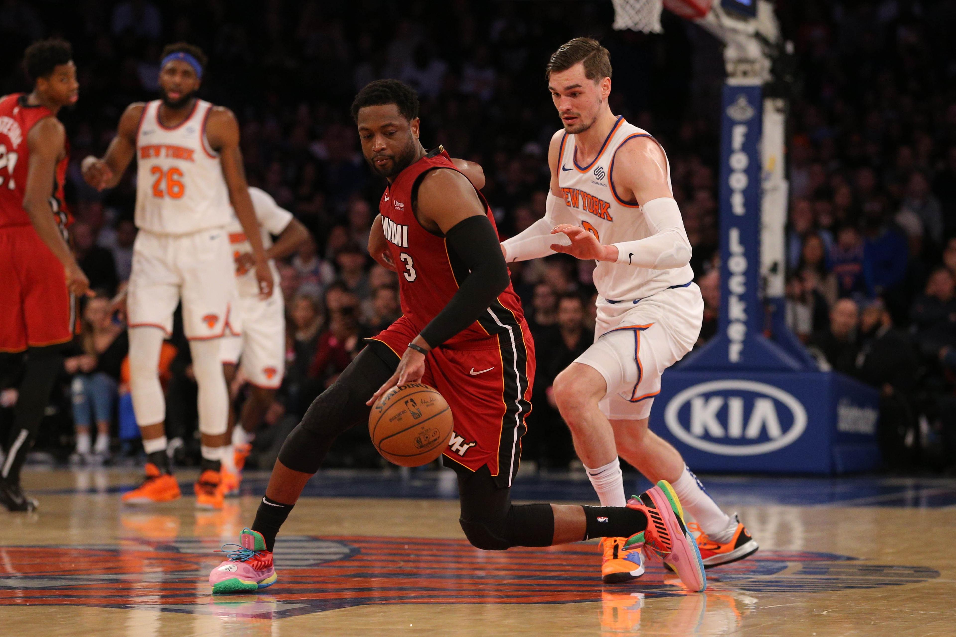 Jan 27, 2019; New York, NY, USA; Miami Heat guard Dwayne Wade (3) controls the ball against New York Knicks forward Mario Hezonja (8) during the fourth quarter at Madison Square Garden. Mandatory Credit: Brad Penner-USA TODAY Sports / Brad Penner