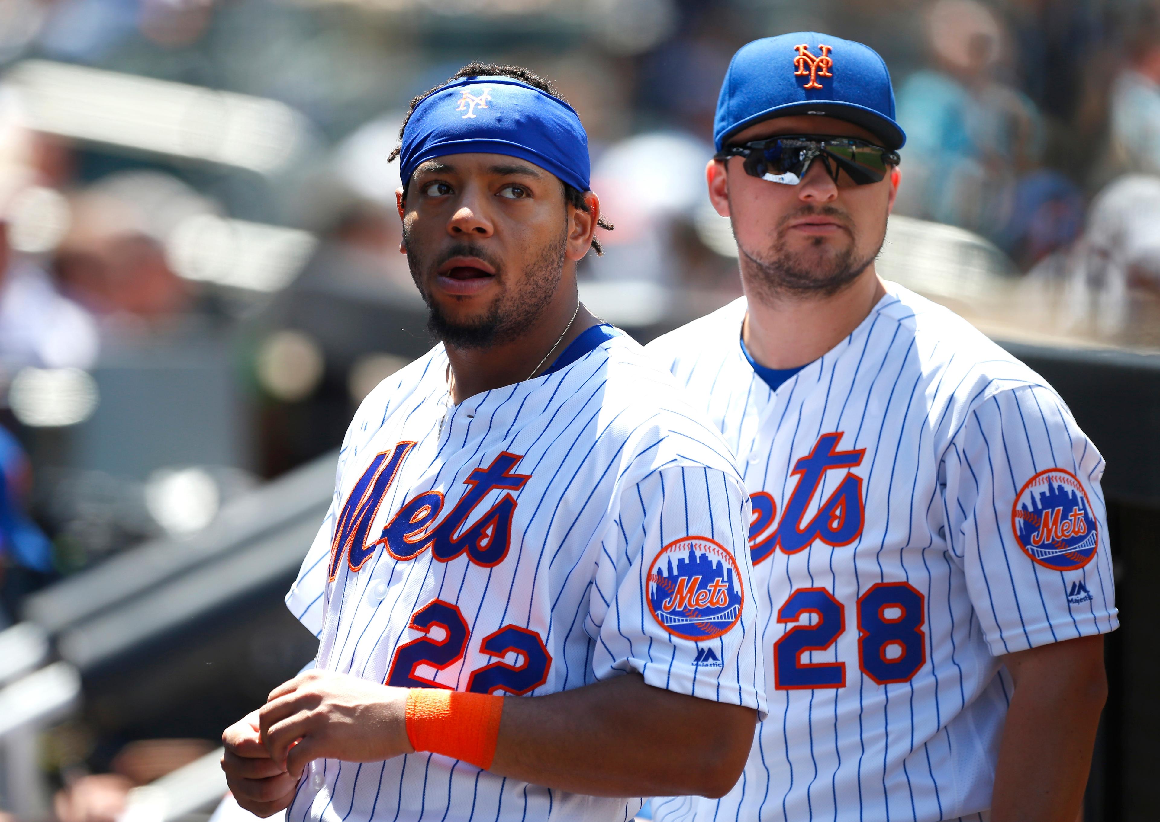 Jun 6, 2019; New York City, NY, USA; New York Mets first baseman Dominic Smith (22) and New York Mets third baseman J.D. Davis (28) look at the scoreboard during game against the San Francisco Giants at Citi Field. Mandatory Credit: Noah K. Murray-USA TODAY Sports