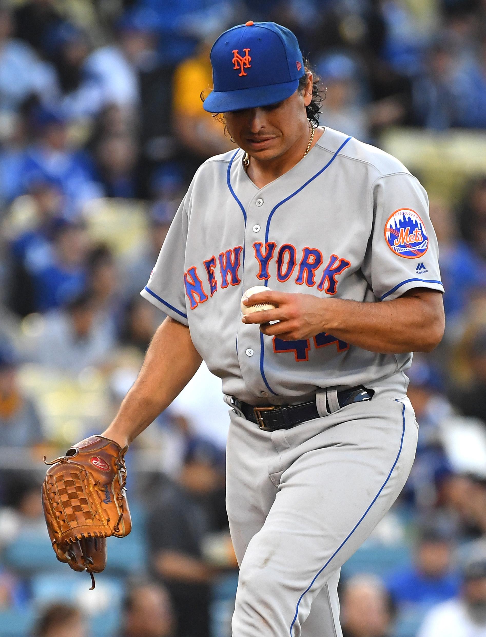 May 30, 2019; Los Angeles, CA, USA; New York Mets starting pitcher Jason Vargas (44) looks at the ball after giving up a run in the first inning of the game against the Los Angeles Dodgers at Dodger Stadium. Mandatory Credit: Jayne Kamin-Oncea-USA TODAY Sports 