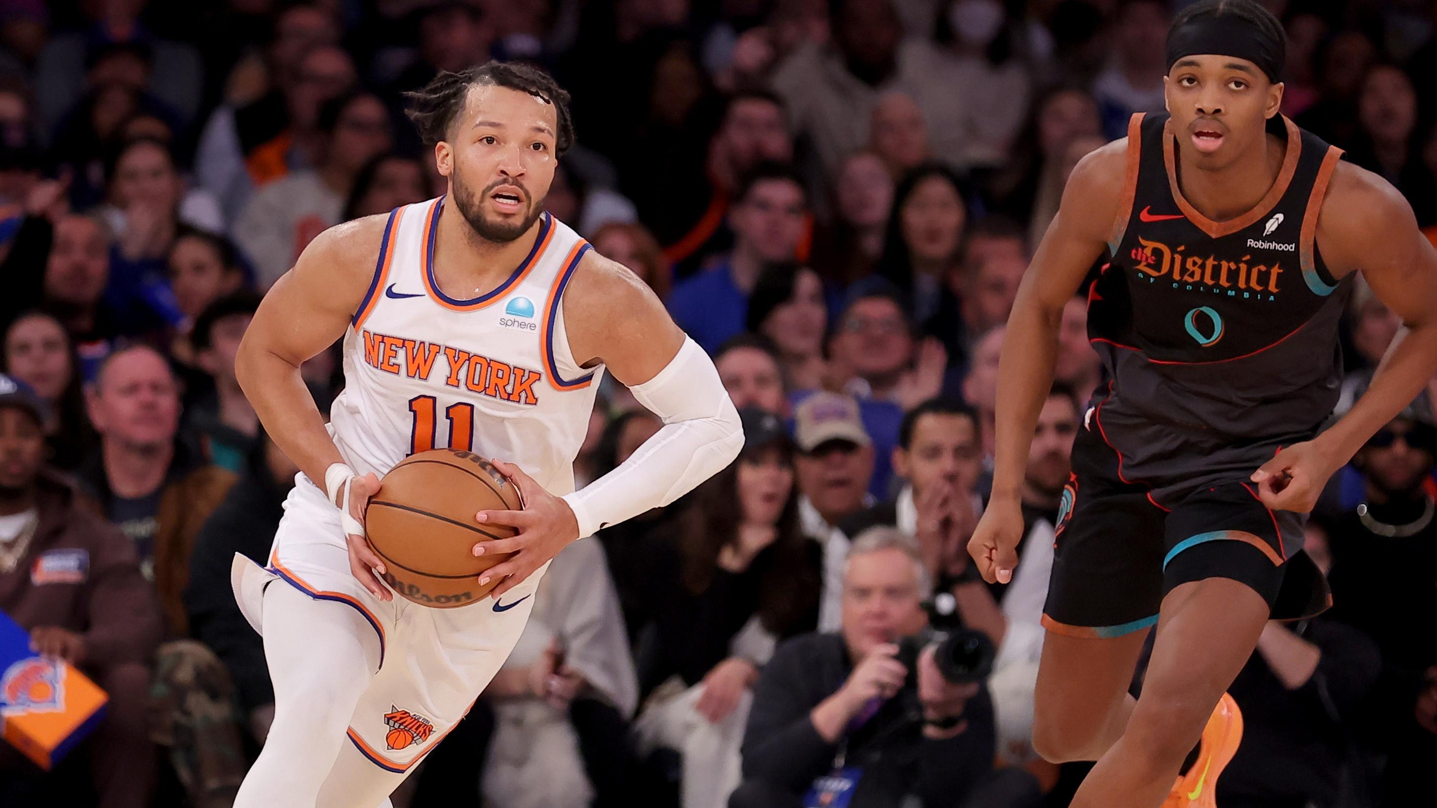 New York Knicks guard Jalen Brunson (11) looks to pass the ball against Washington Wizards guard Bilal Coulibaly (0) during the second quarter at Madison Square Garden / Brad Penner - USA TODAY Sports