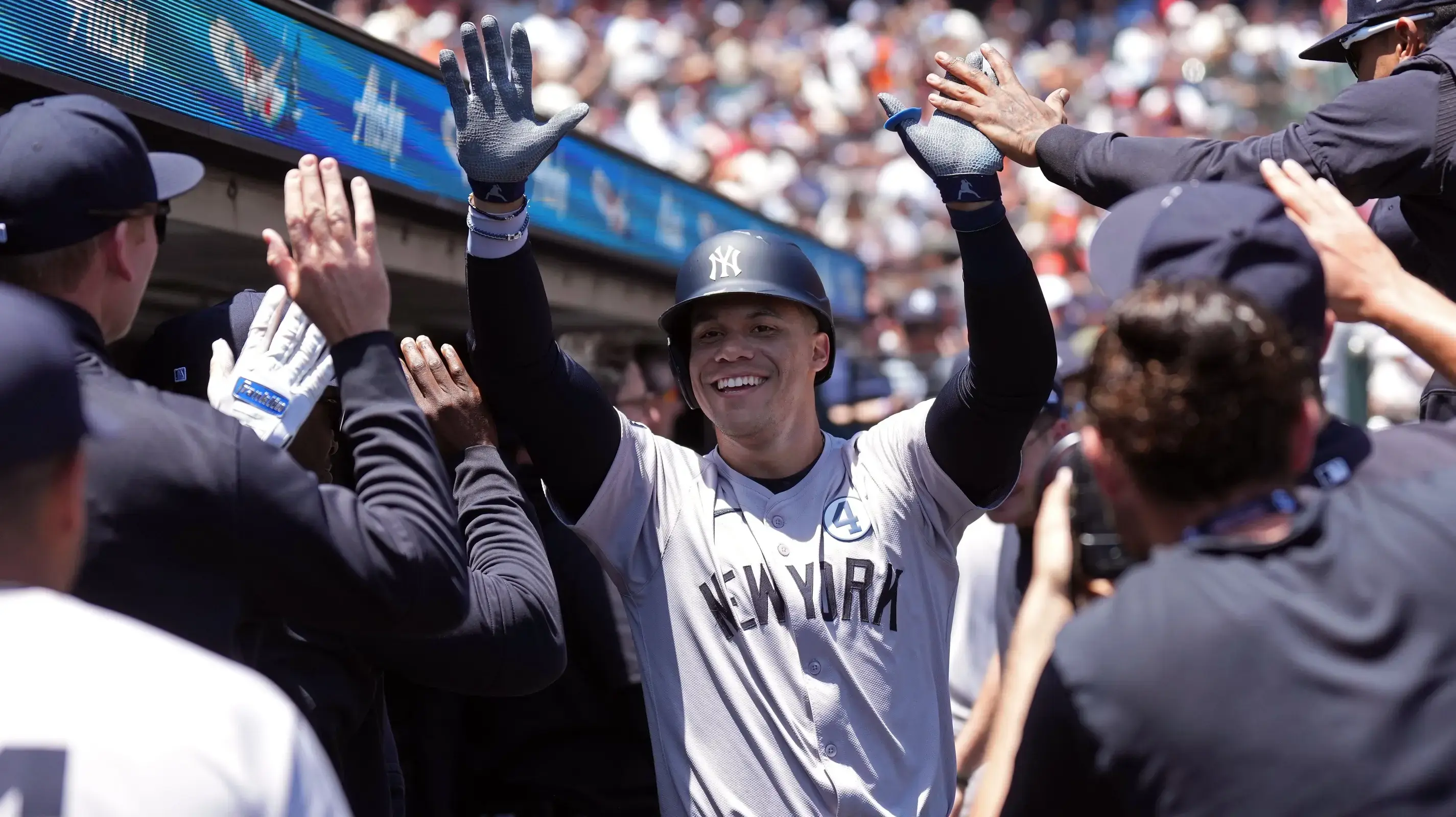 New York Yankees right fielder Juan Soto (center) is congratulated by teammates after hitting a home run against the San Francisco Giants during the first inning at Oracle Park. / Darren Yamashita-USA TODAY Sports