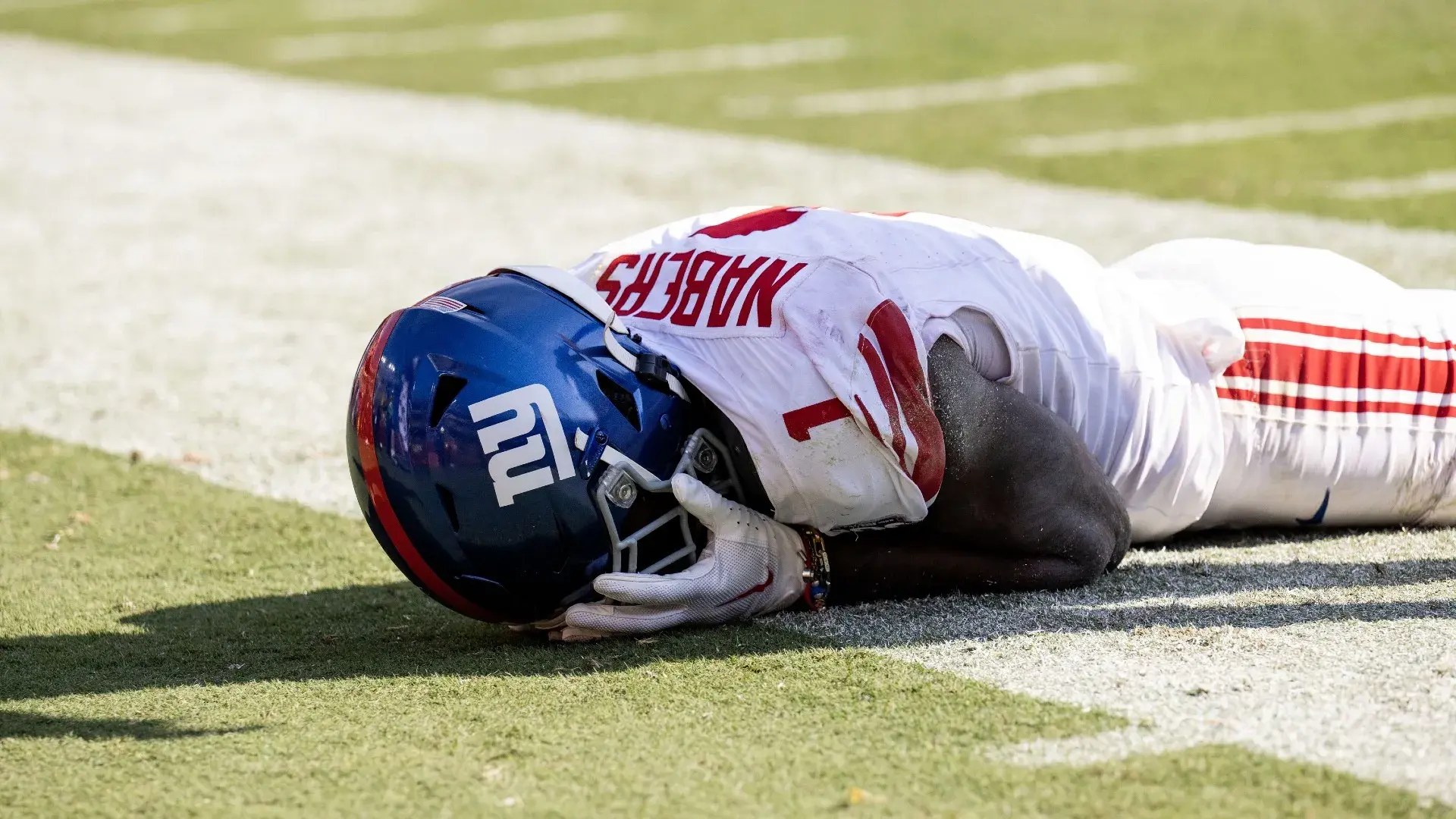 New York Giants wide receiver Malik Nabers (1) holds his face after dropping a pass against the Washington Commanders in the second half at Commanders Field. / Luke Johnson-Imagn Images